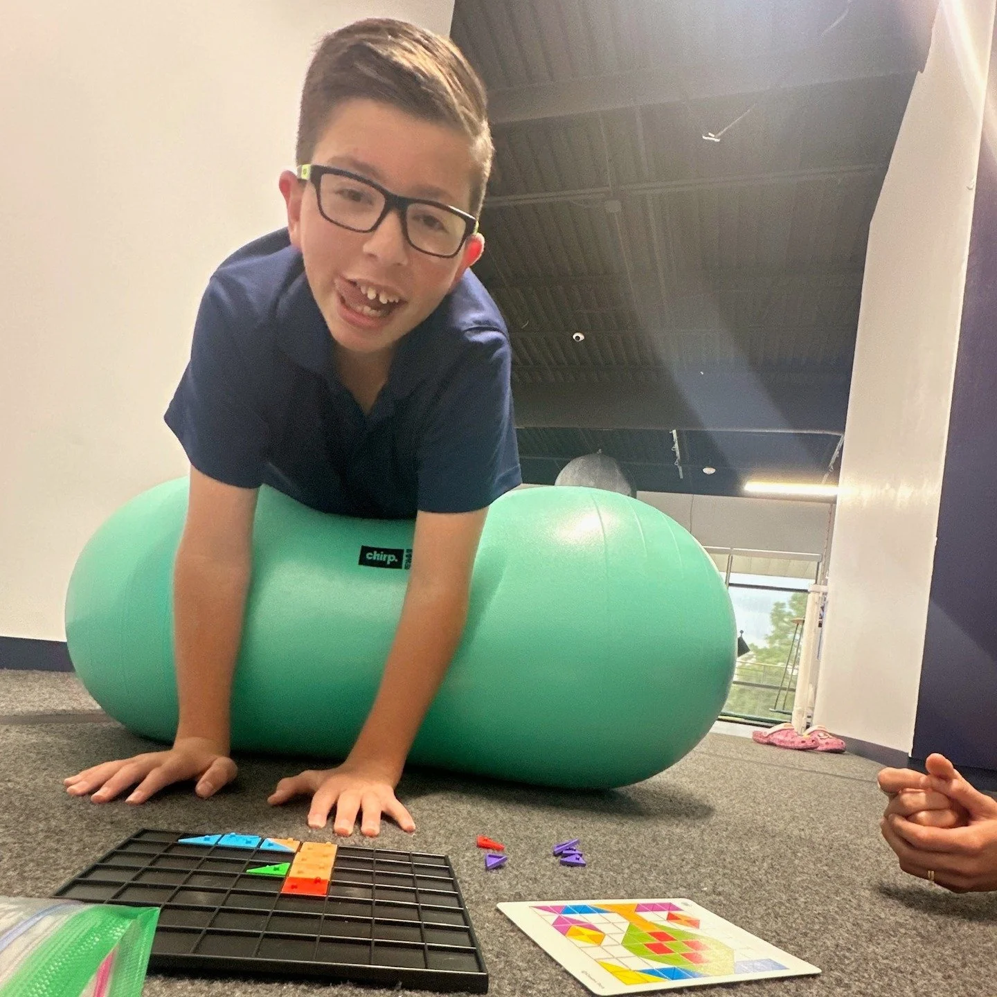 Building skills through movement and play! 💫
This kiddo is laying on his stomach on a peanut ball, which helps activate core muscles, improve posture, and support sensory regulation — all while staying engaged in a fun, skill-building task.