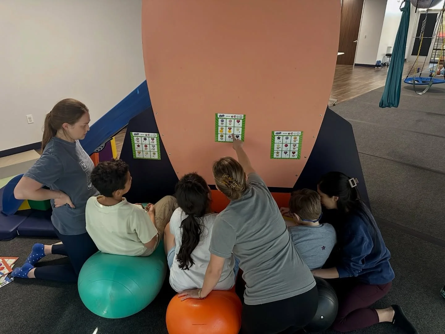 Teamwork makes therapy fun! 🚀

Our astronauts are playing descriptive bingo while sitting on therapy balls to challenge their core strength, balance, listening, and language skills. When PT, OT, and speech come together, learning becomes movement, p