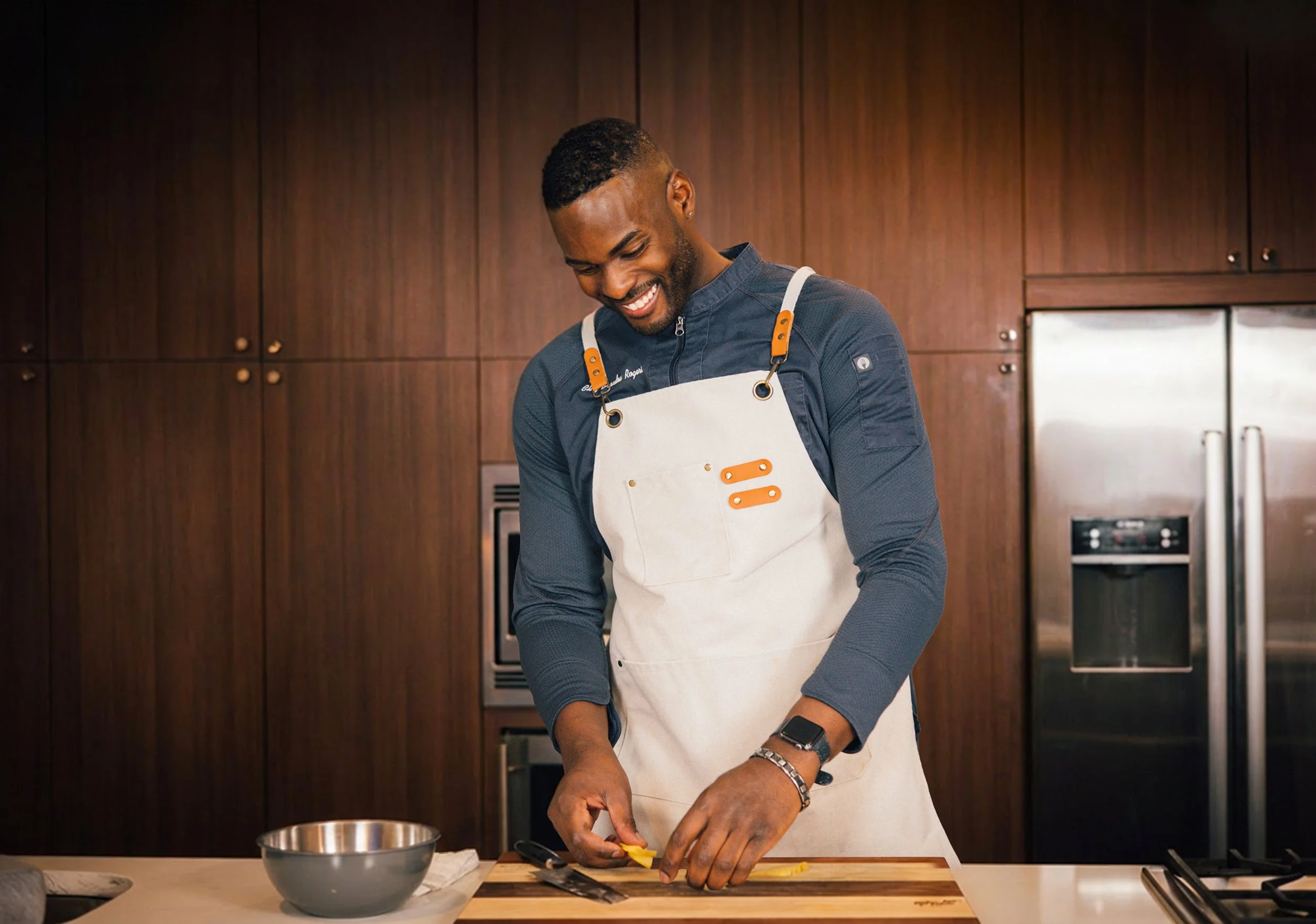 Chef presenting dishes to guests during a private tasting menu