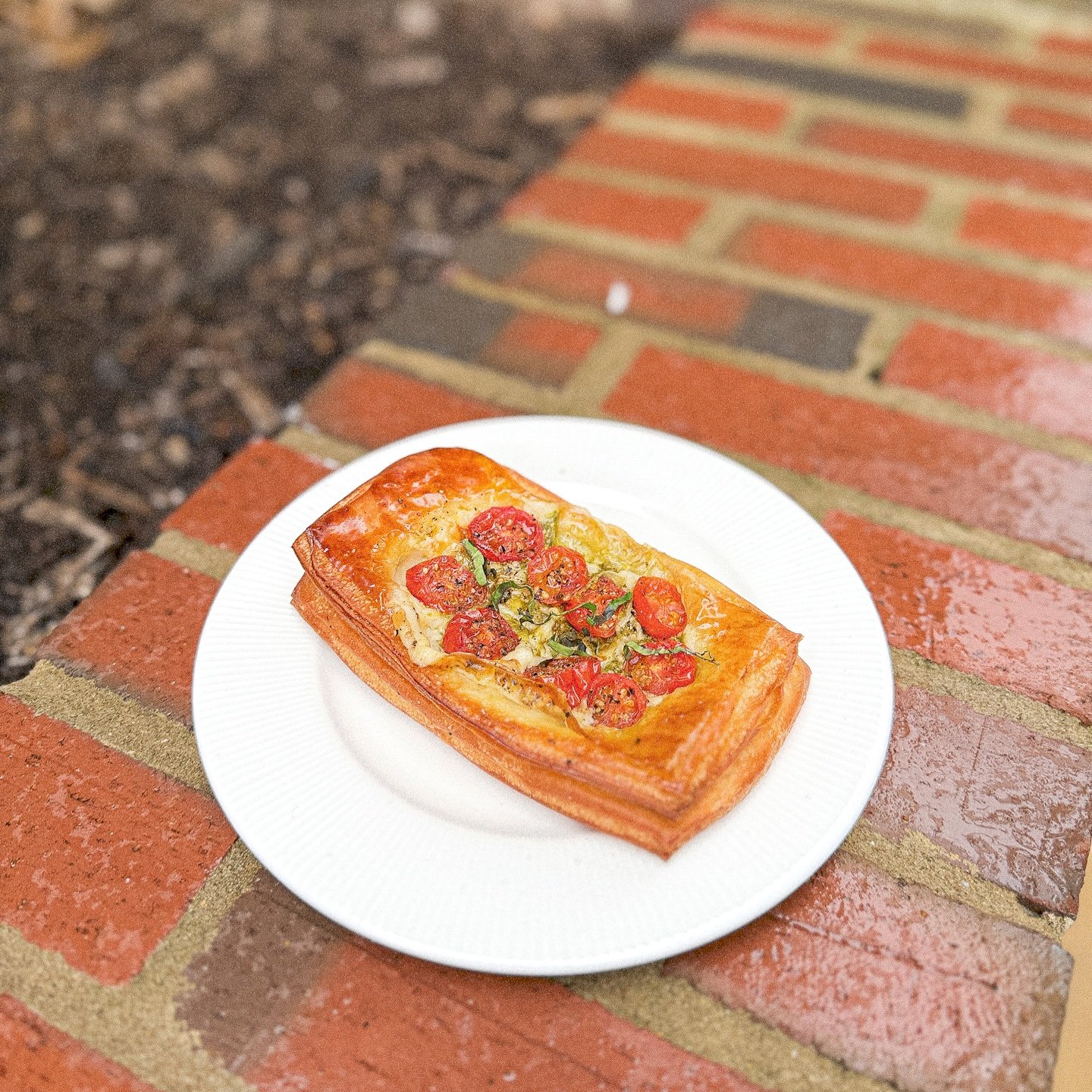 Flaky, buttery, and packed with flavor&mdash;our Pesto Tomato Croissant is the perfect savory bite! 🍅✨ 
Fresh cherry tomatoes, rich pesto, and melty cheese atop golden, crispy layers. 
Available now at the KANOM caf&eacute;&mdash;come grab yours! 
#