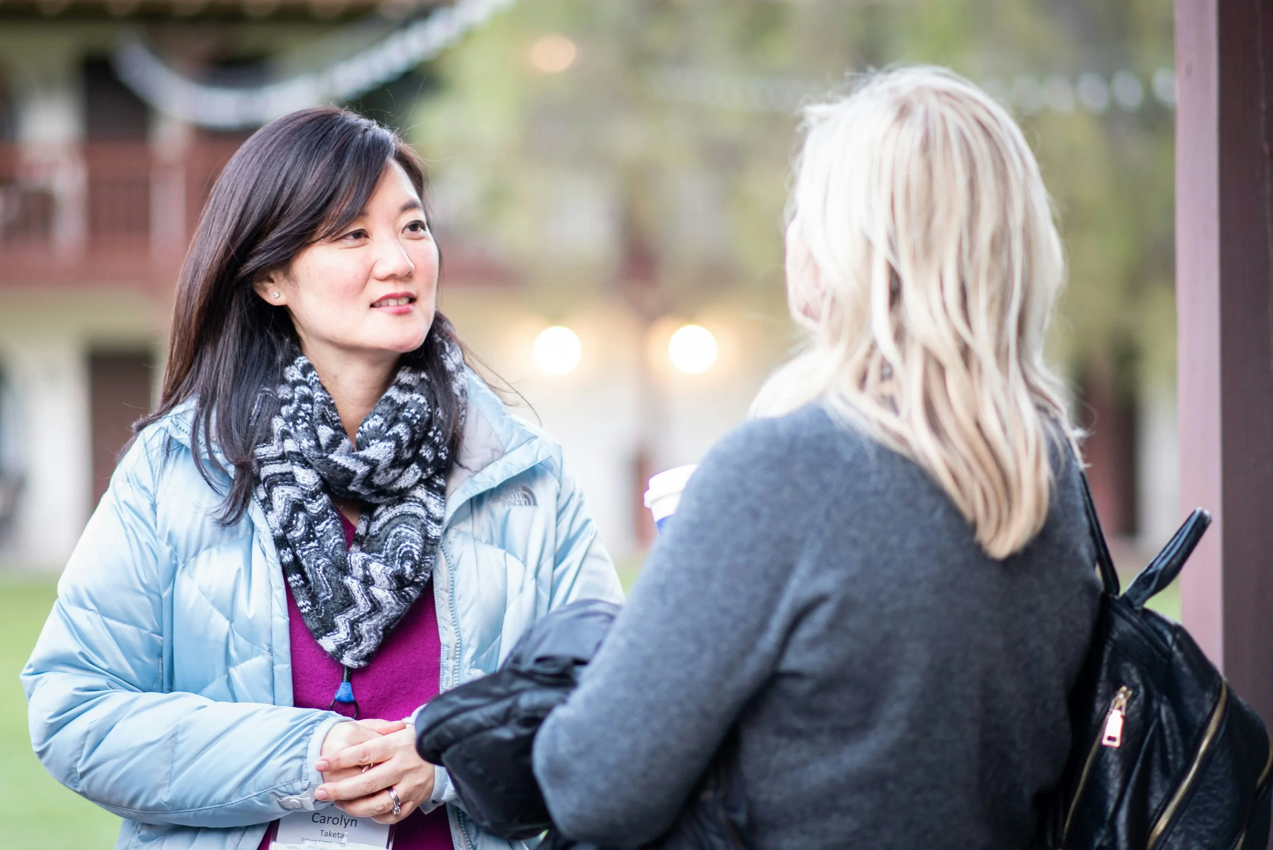 Two women chatting outside