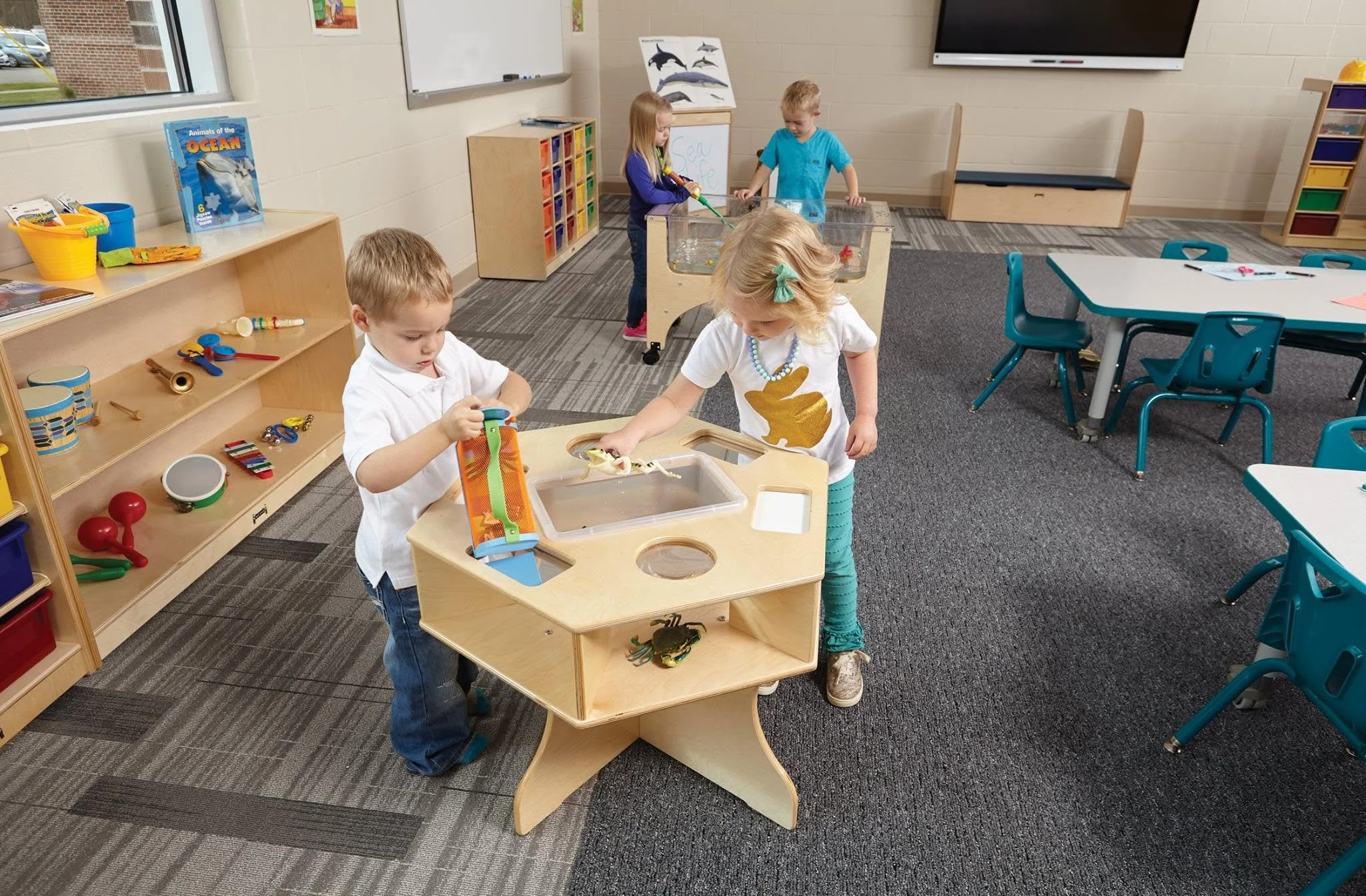 A modern middle school classroom space designed by Oxilium, featuring collaborative mobile desks, active learning stools, and integrated edtech displays engineered for interactive, neuro-inclusive secondary education.