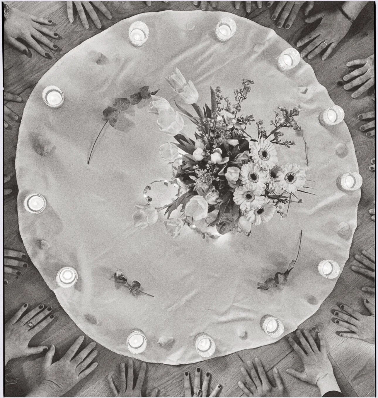 A women's circle and women's hands. 