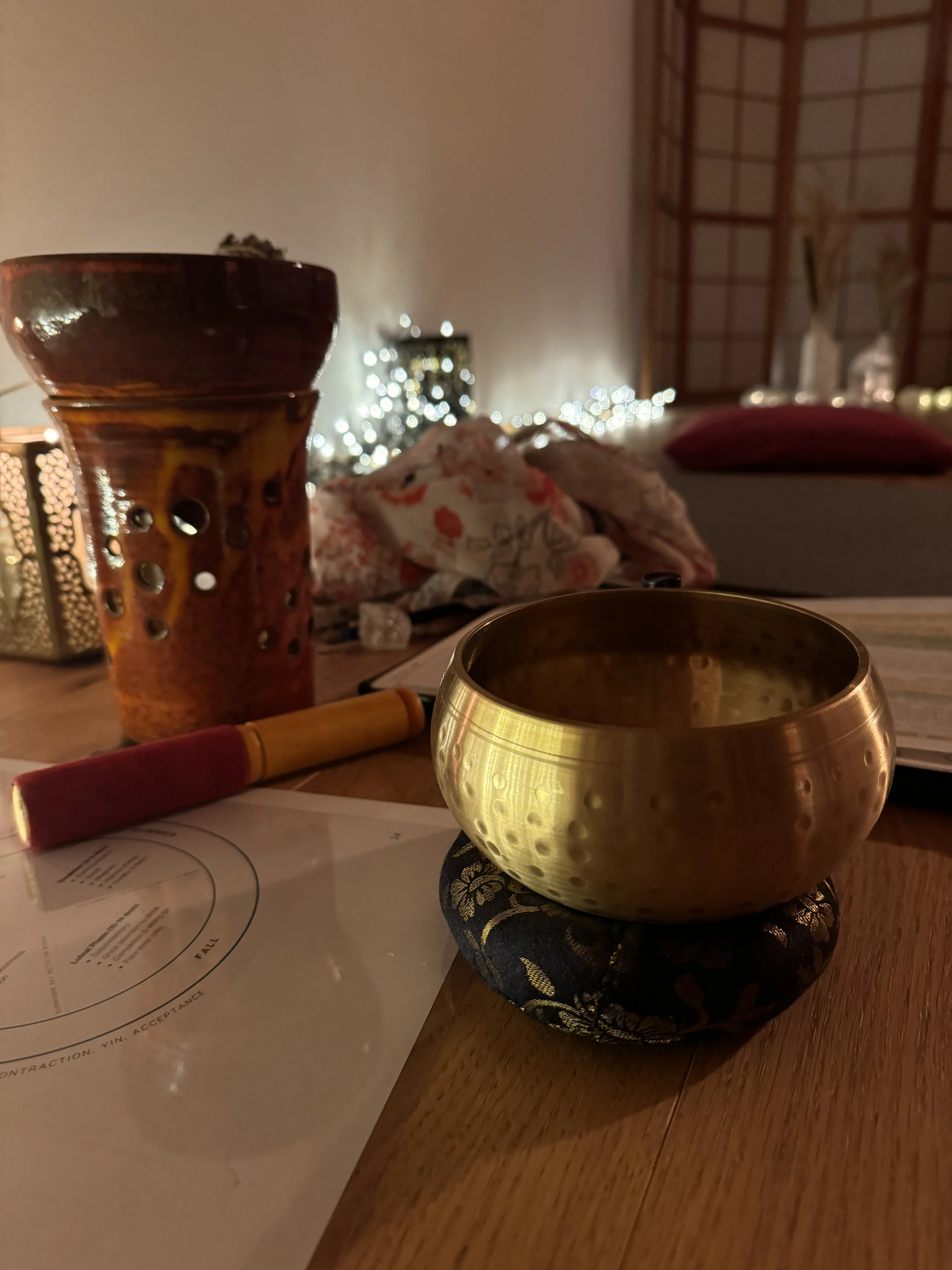 Singing bowl and ritual objects prepared for an embodied practice.

