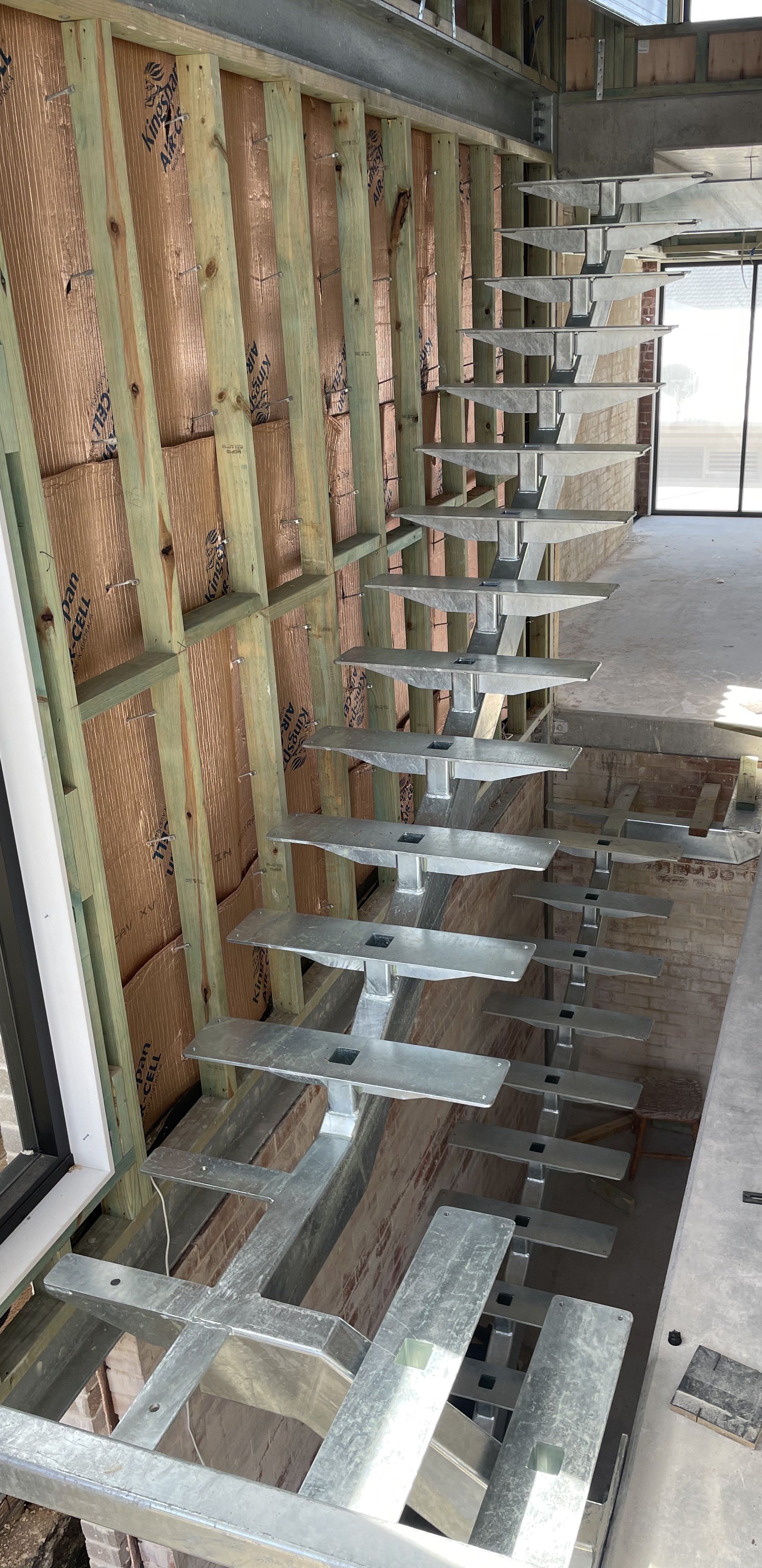 Single spline stairs architecturally designed for timber treads. Connecting three stories in an apartment block.