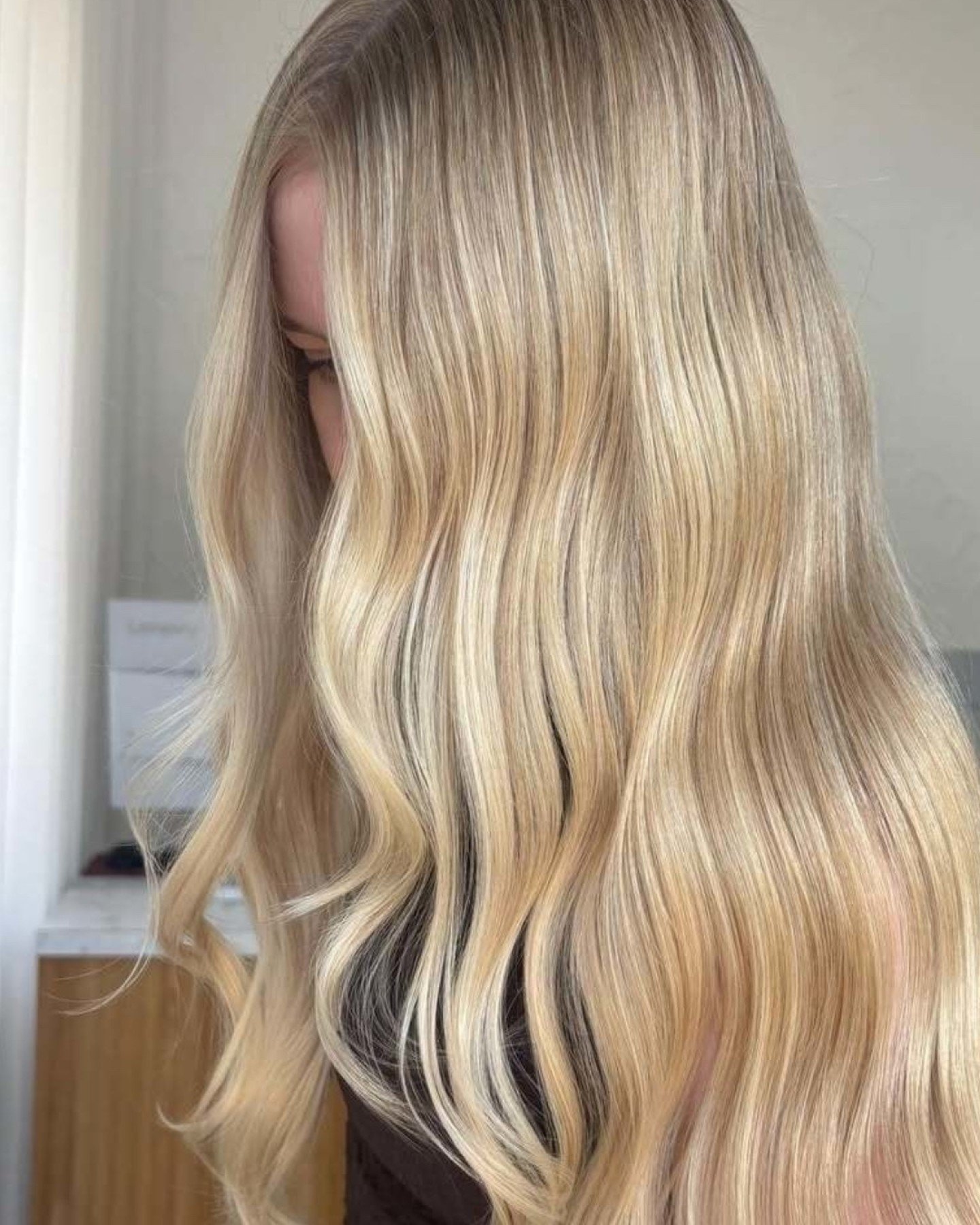 This is Kym's chair - where lived-in balayage meets infectious energy

22 years of perfecting her craft while keeping you laughing the entire time. Her wit is as sharp as her colour skills, and that laugh? You'll hear it from across the salon and can