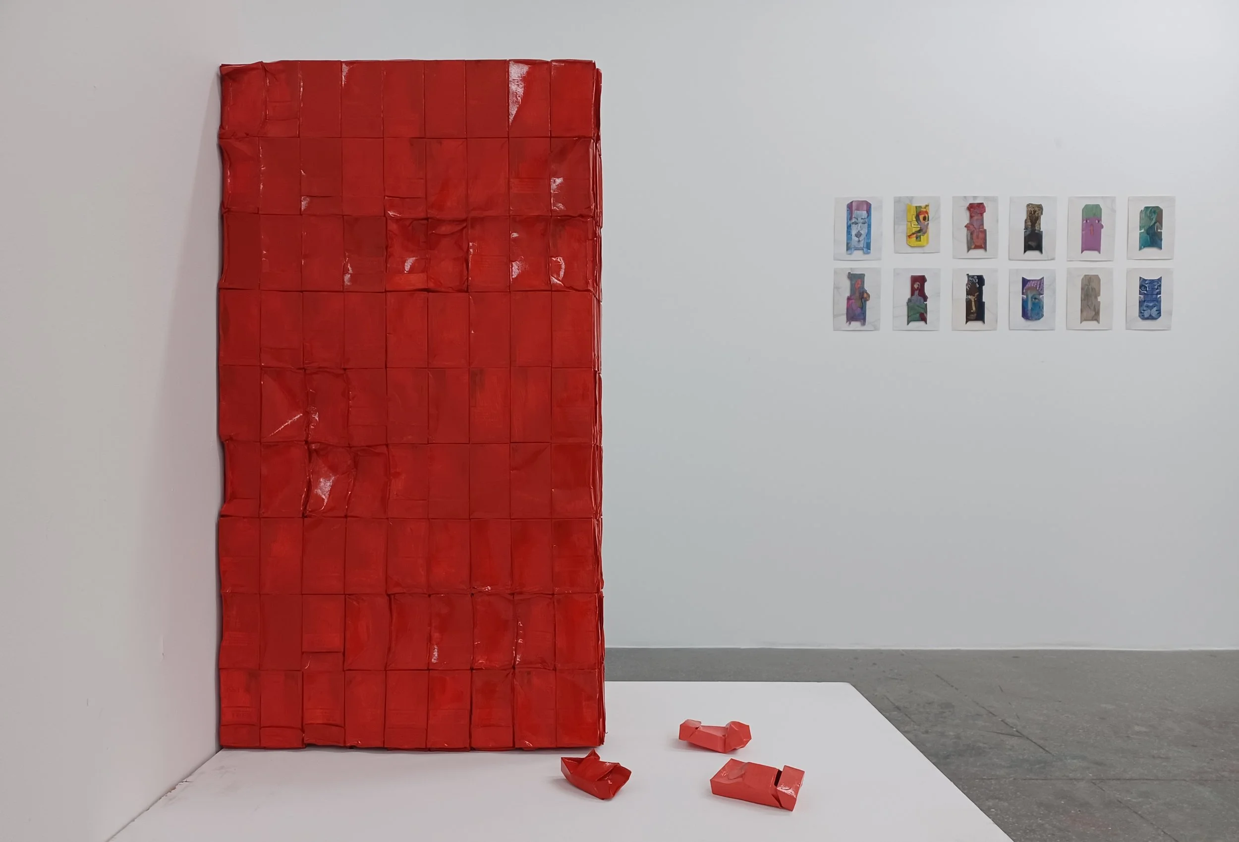 Traces of the Unseen, 2025, Acrylic on 563 cigarette packs, 37" x 21.5" x 4.5"