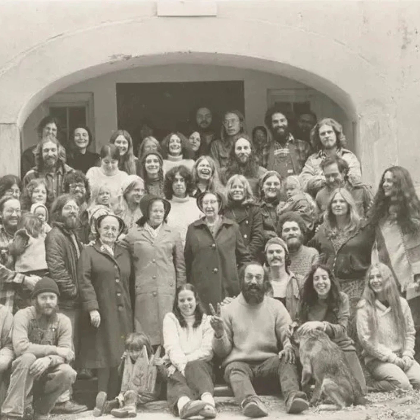 If you wander into Razzaq and step into the Dining Hall, you&rsquo;ll find a beautiful, large photograph from 1975. It captures a couple dozen or so early inhabitants of the Abode alongside a few of the last Shaker Sisters, who traveled back from the