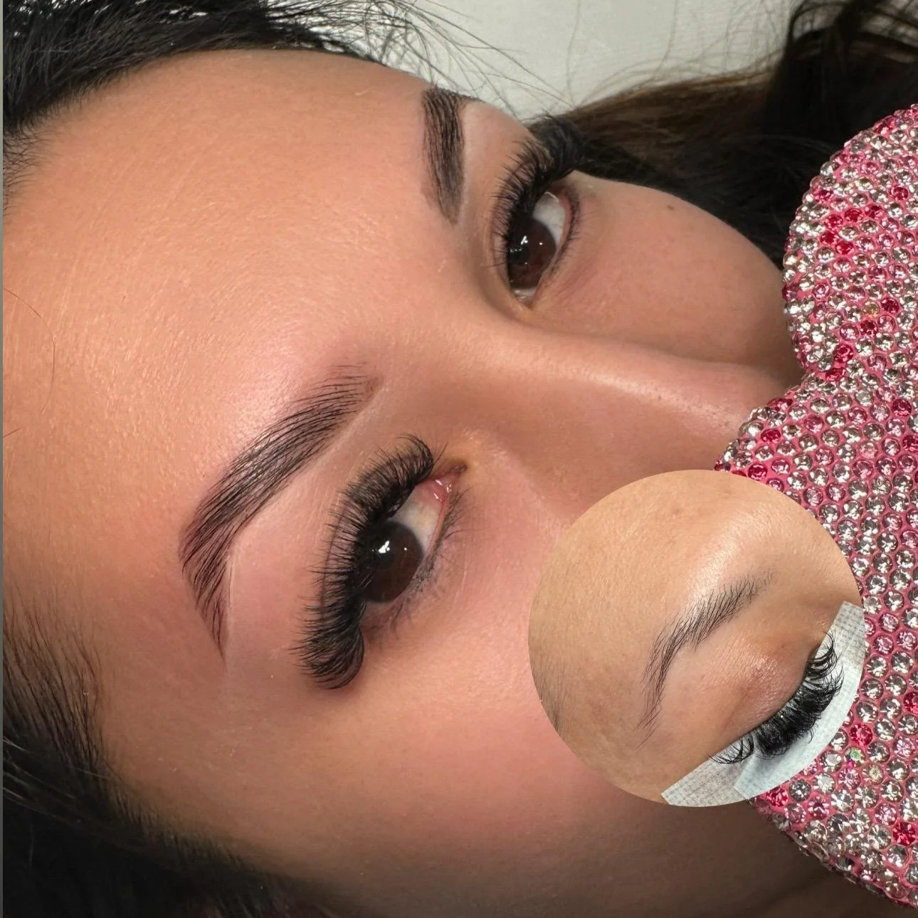 Close-up of a woman's face showing freshly done eyelash extensions, with a smaller inset image of her natural eyelashes.