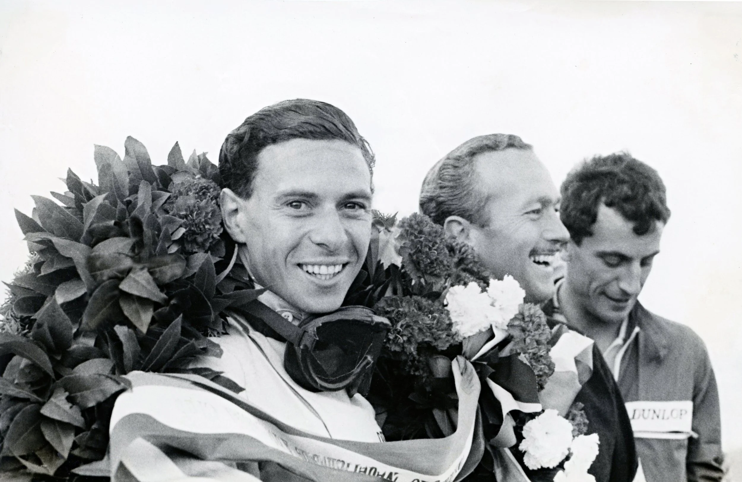 (30) Jim-Clark-celebrates his triumph with the Lotus Type 38.jpg