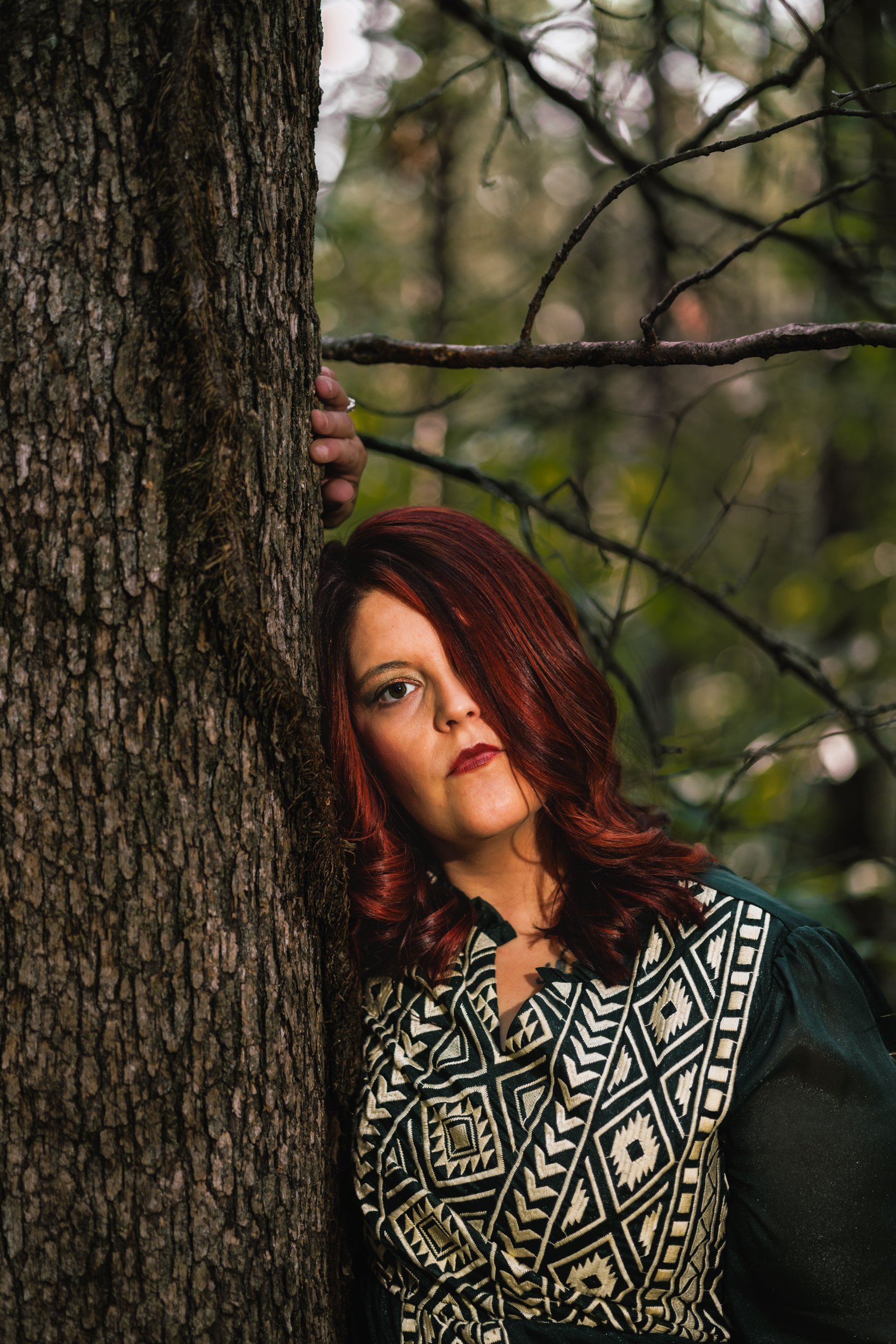 Red Headed Woman in Woods in Green Dress