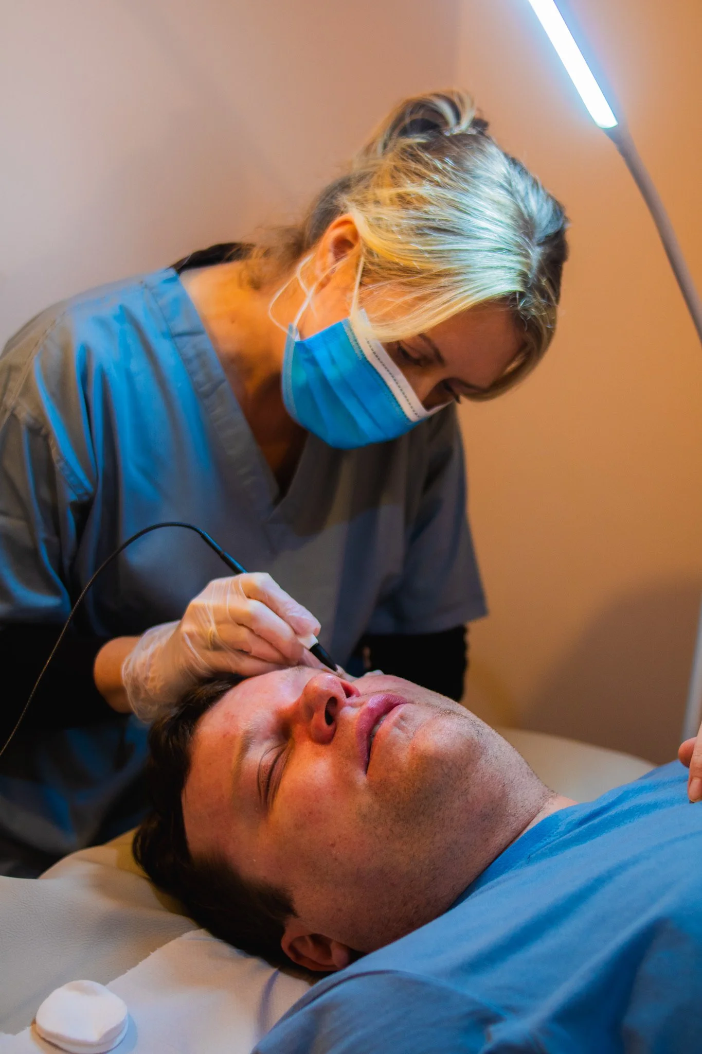 Rebecca administering blemish removal treatment at the salon in Bristol