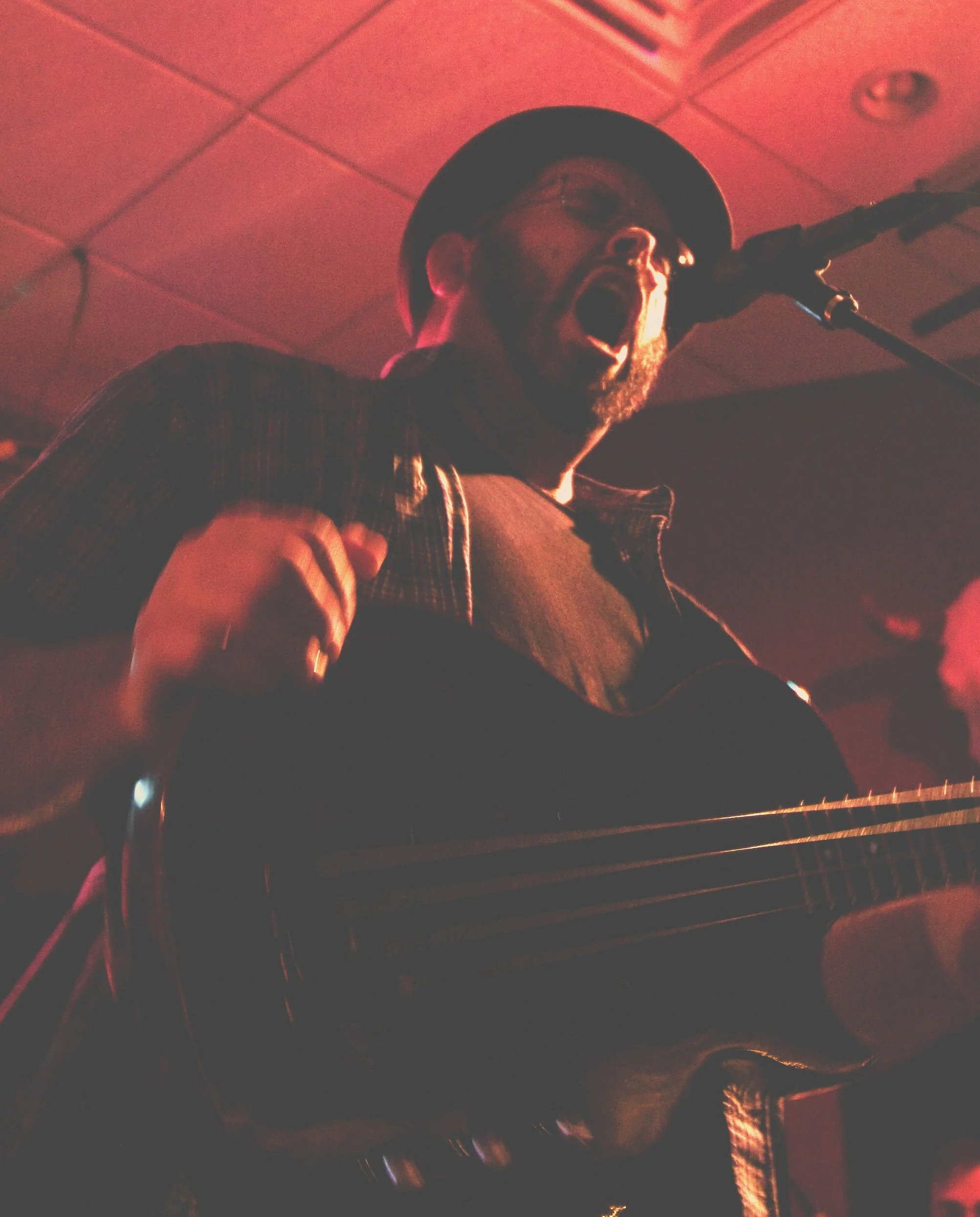 picture of arte k singing into a microphone