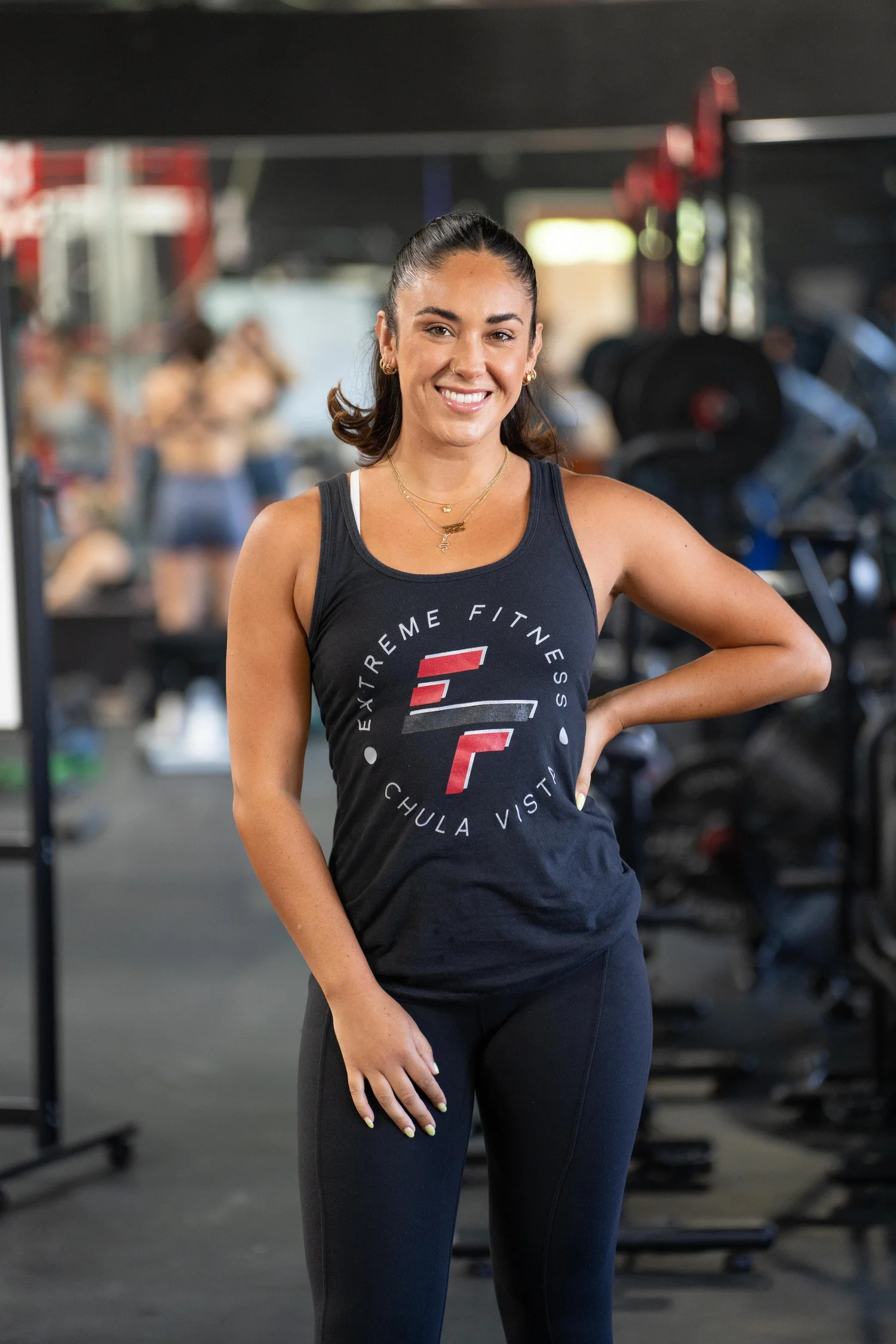 A member standing in front of the equipment at Extreme Fitness Eastlake.