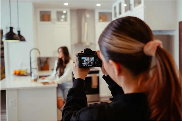 Influencer films content for brand deal on her social media platforms