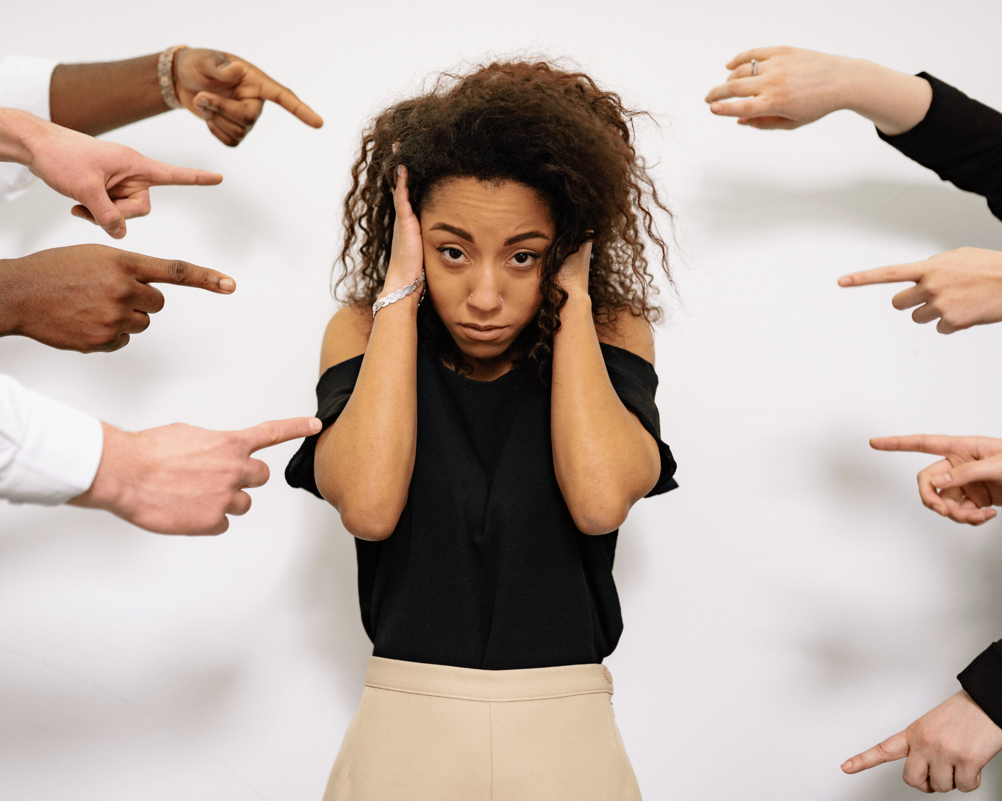 Image of overwhelmed and stressed out adult woman feeling shamed by others to illustrate what is parentification trauma in Colchester, Connecticut and Virginia