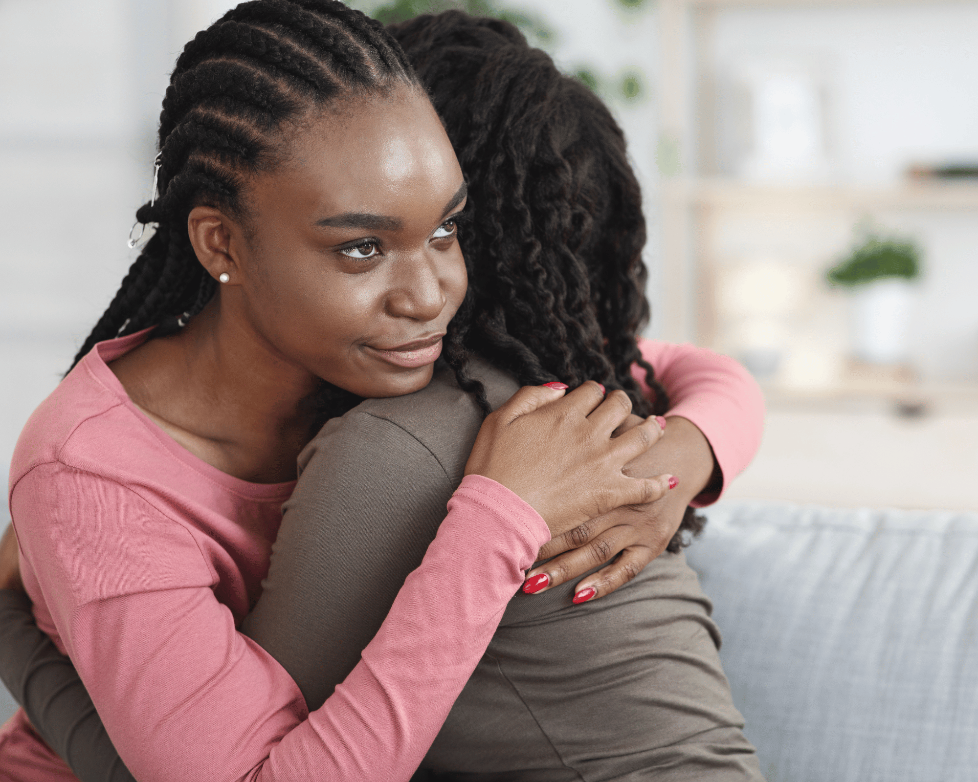 Image of annoyed teen daughter feeling pressured to hug parent to show impact of gaslighting and how to heal with online therapy in Colchester, CT and Virginia