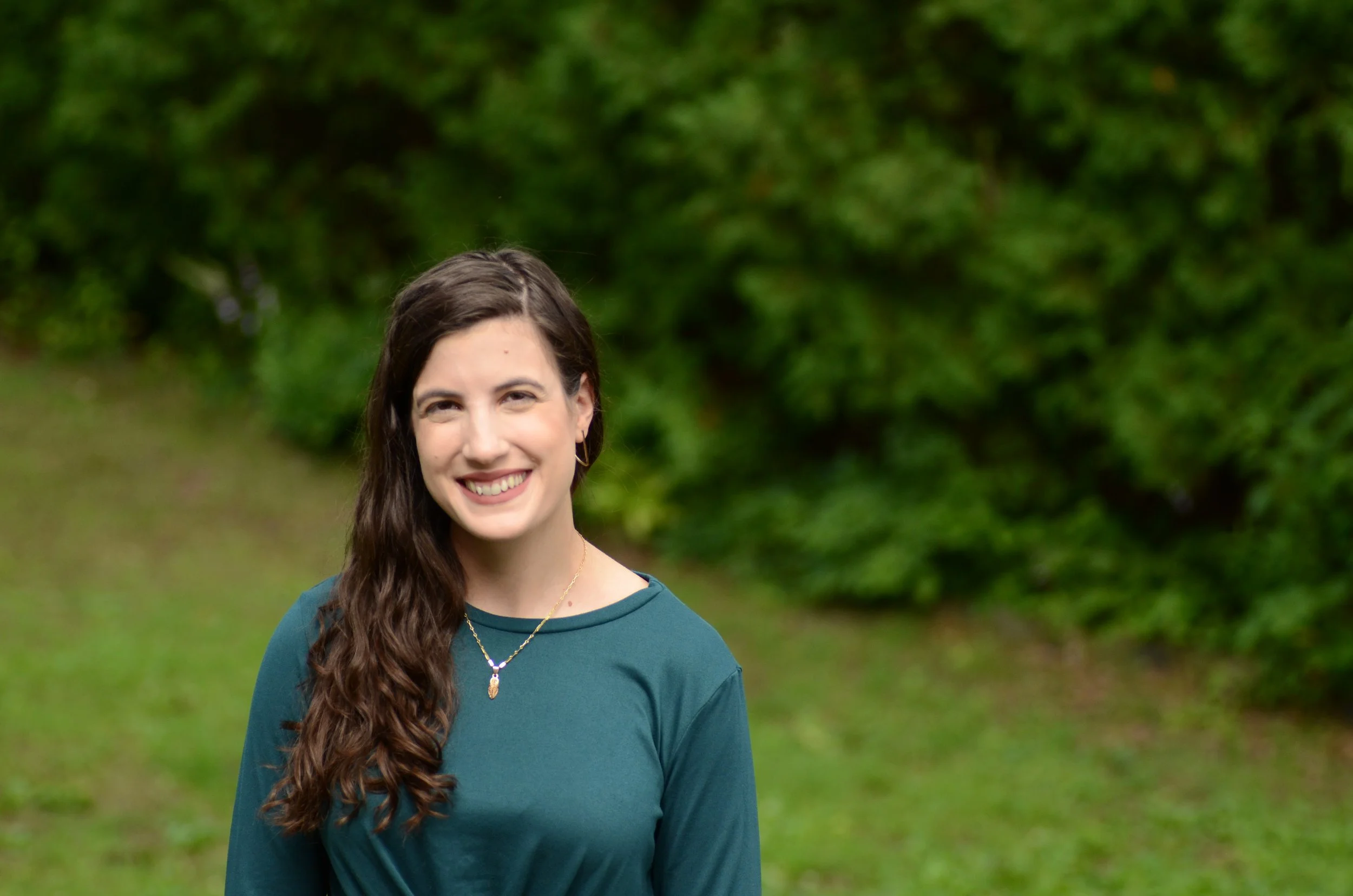 Therapist, Alice Zic, standing outside and smiling, representing supportive care offered through therapy in New Orleans, LA.
