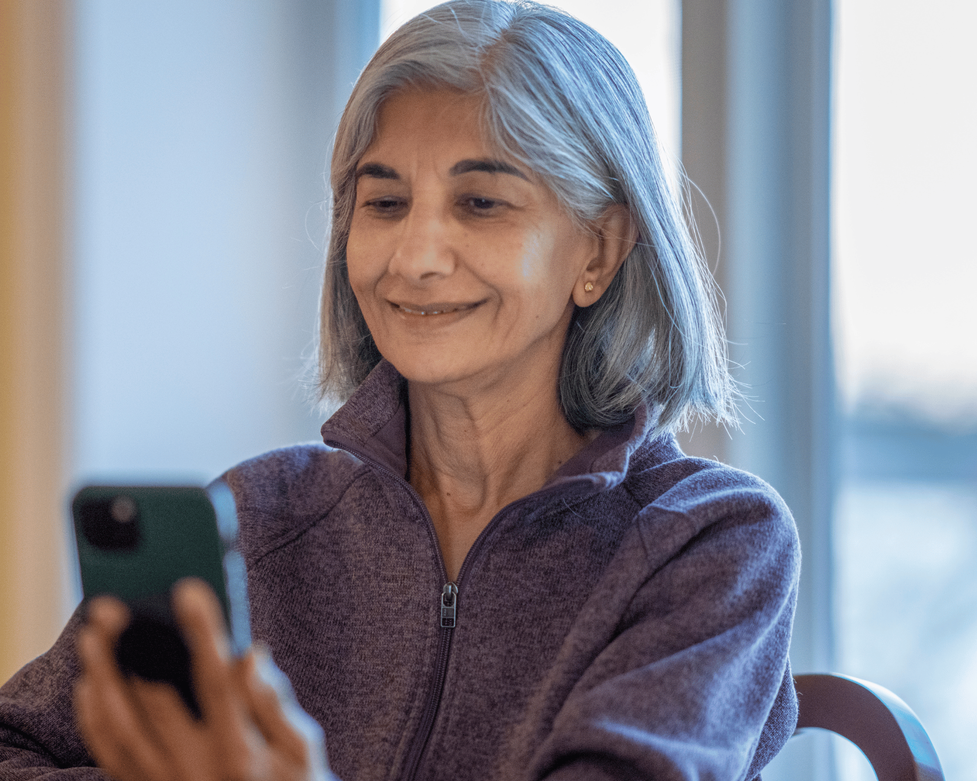 Image of older adult woman in online therapy session to show healing power and benefit of online therapy for healing gaslighting in Colchester, CT and Virginia
