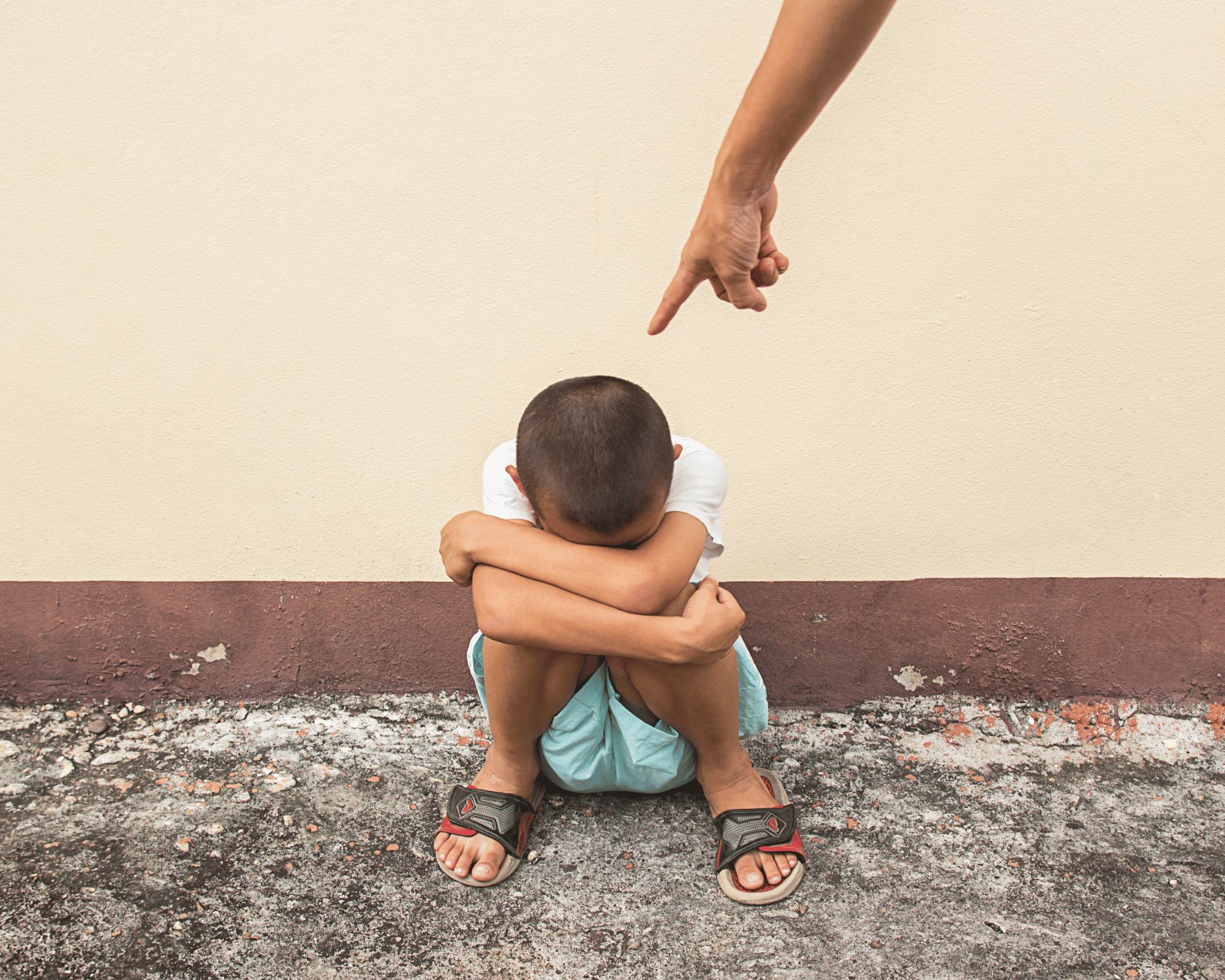 Image of scared little boy being blamed by adult to illustrate impact of gaslighting and how to heal with online therapy in Colchester, CT and Virginia