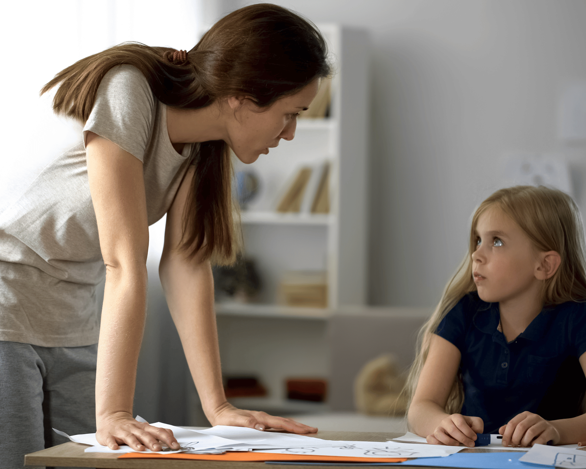 Image of young daughter feeling intimidated/scared by angry mother to illustrate what is parentification trauma in Colchester, Connecticut and Virginia