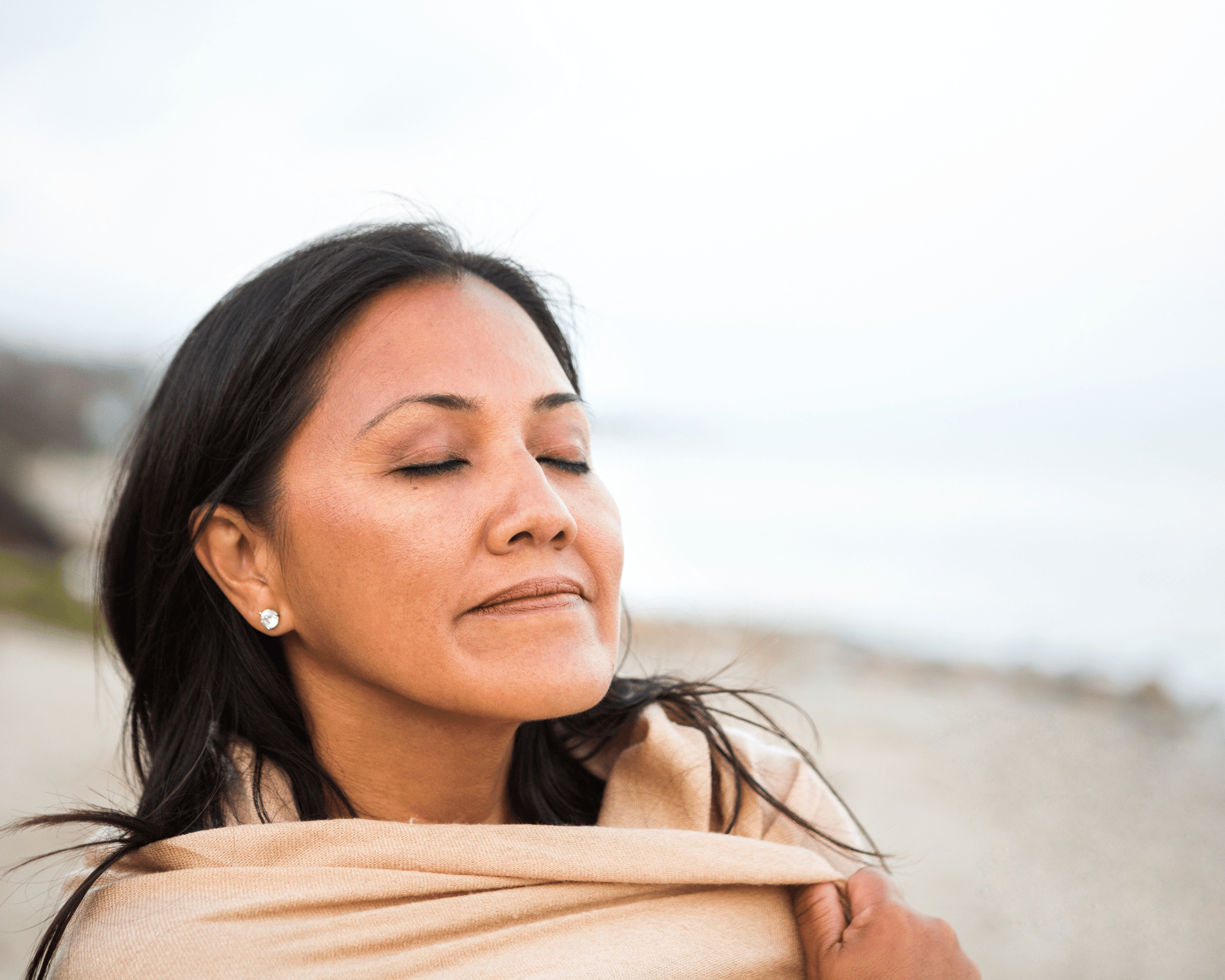Image of woman at peace on Grand Isle Beach State Park, LA to show trauma therapy and therapy for teen anxiety in New Orleans, LA, Connecticut, and Virginia