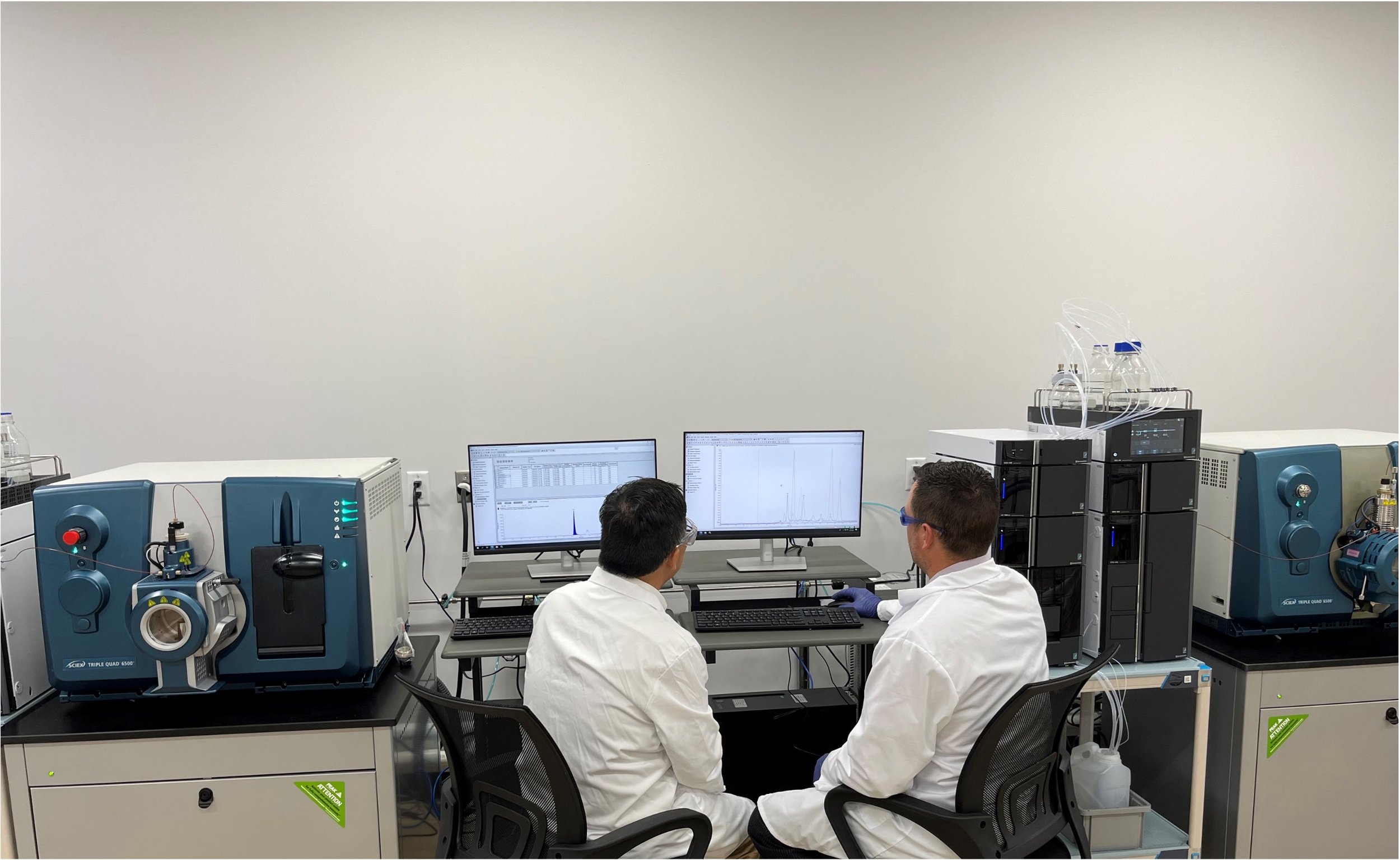 Two scientists analyzing scientific data on a computer