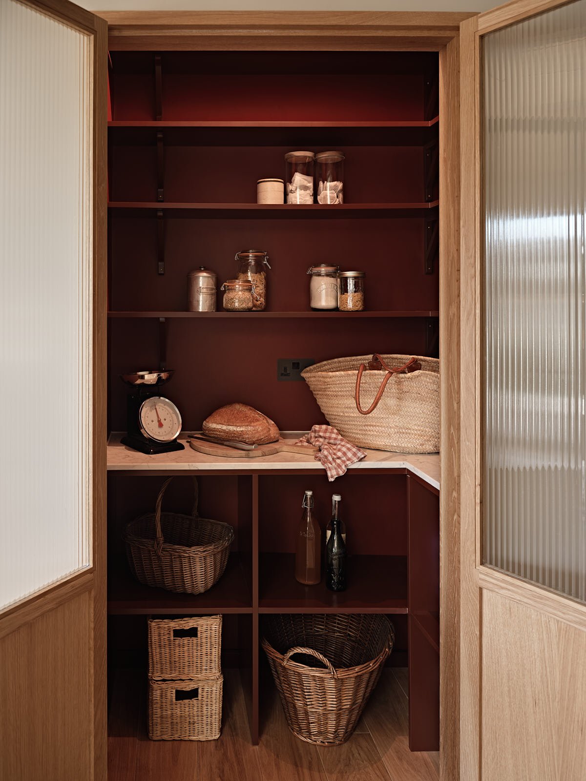 Deep red walk-in pantry in a Aldersbrook Kitchen renovation designed by Studio Eight Design.