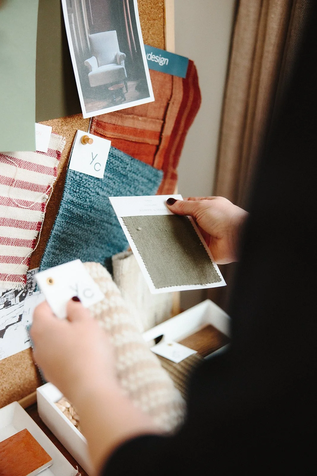 Hannah Gilchrist reviewing fabric and colour samples
