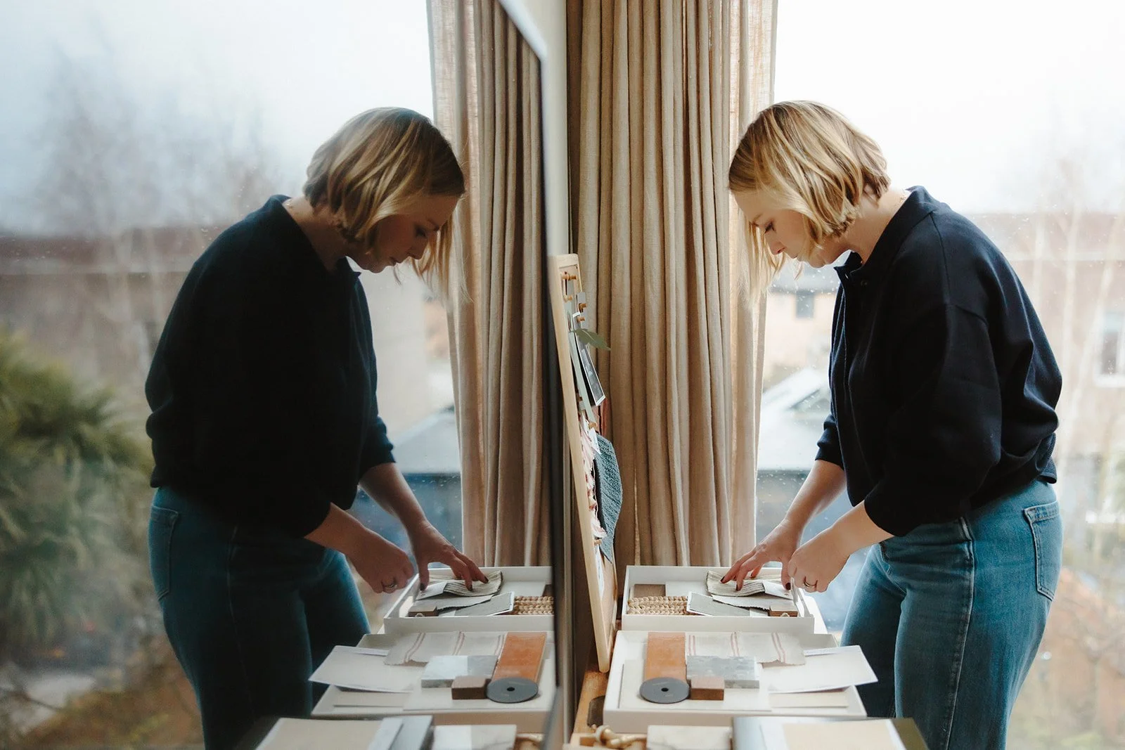 Hannah Gilchrist reviewing fabric and colour samples.