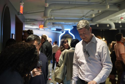 CNCT members chatting at an evening social