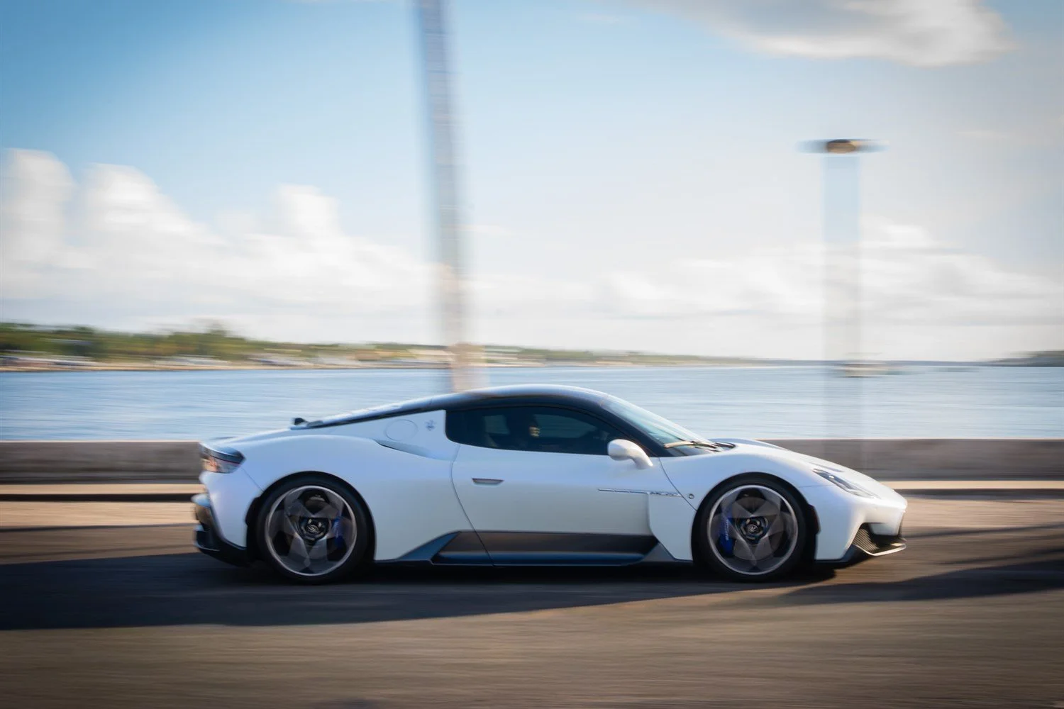 12 - maserati-mc20-side-profile-motion-blur-coastal.jpg