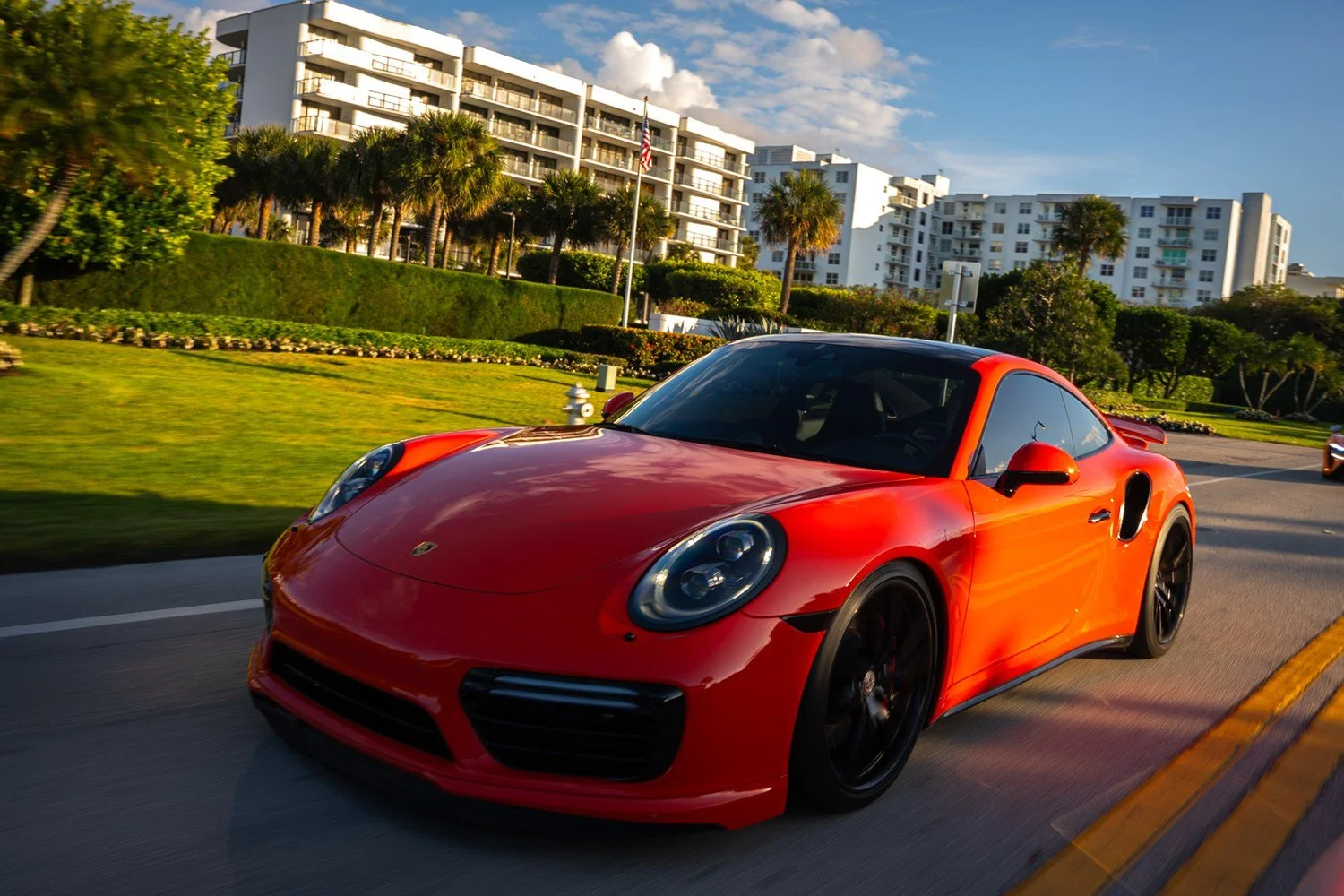 01 - porsche-911-turbo-s-front-three-quarter-motion-open-road.jpg