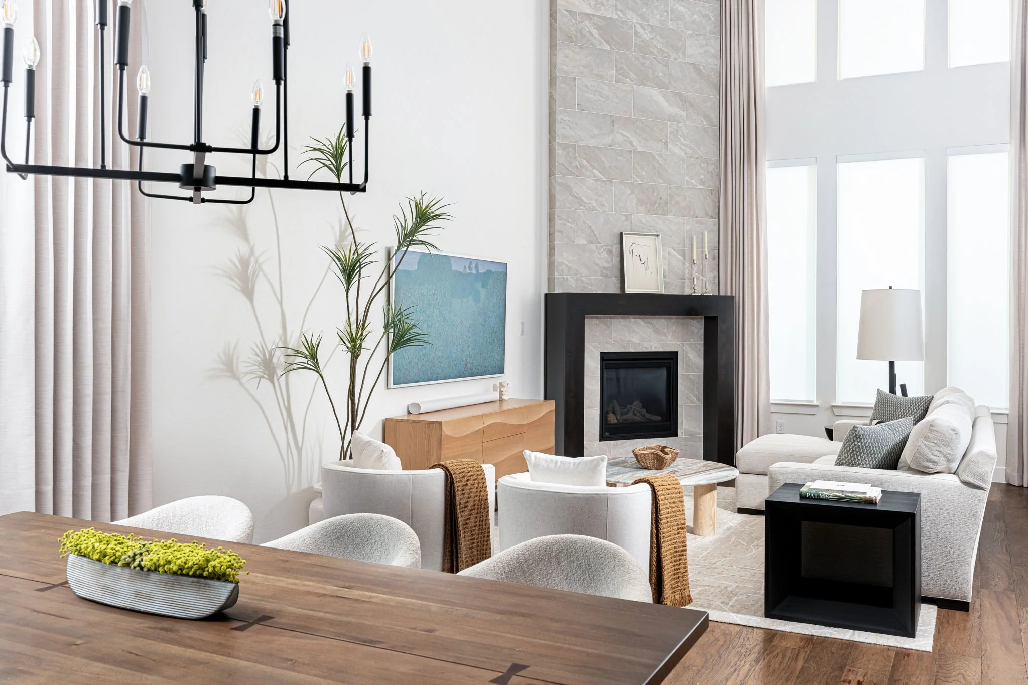 Prosper texas family room with contemporary furnishings and double height windows