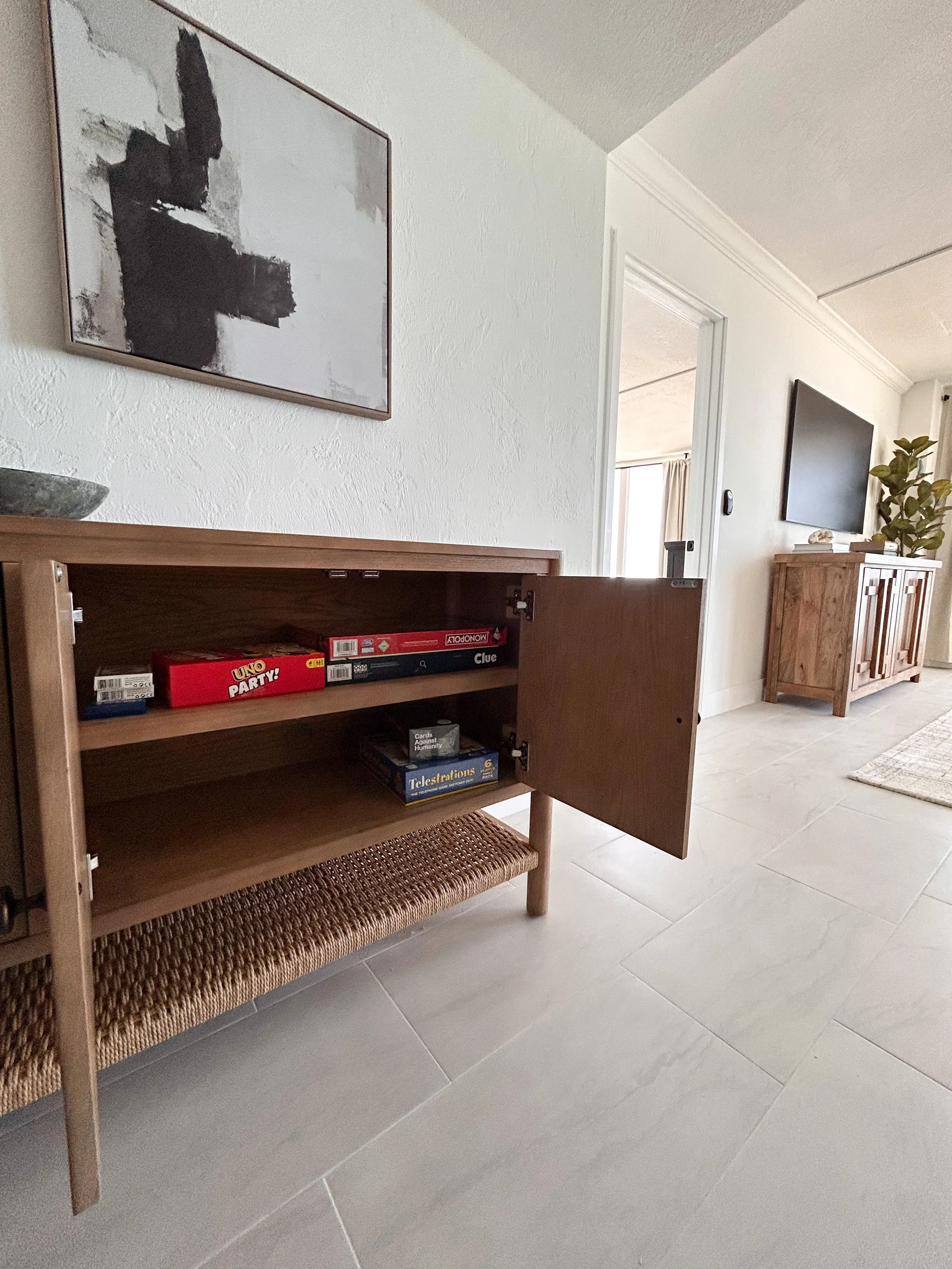 entry cabinet with board games.JPEG