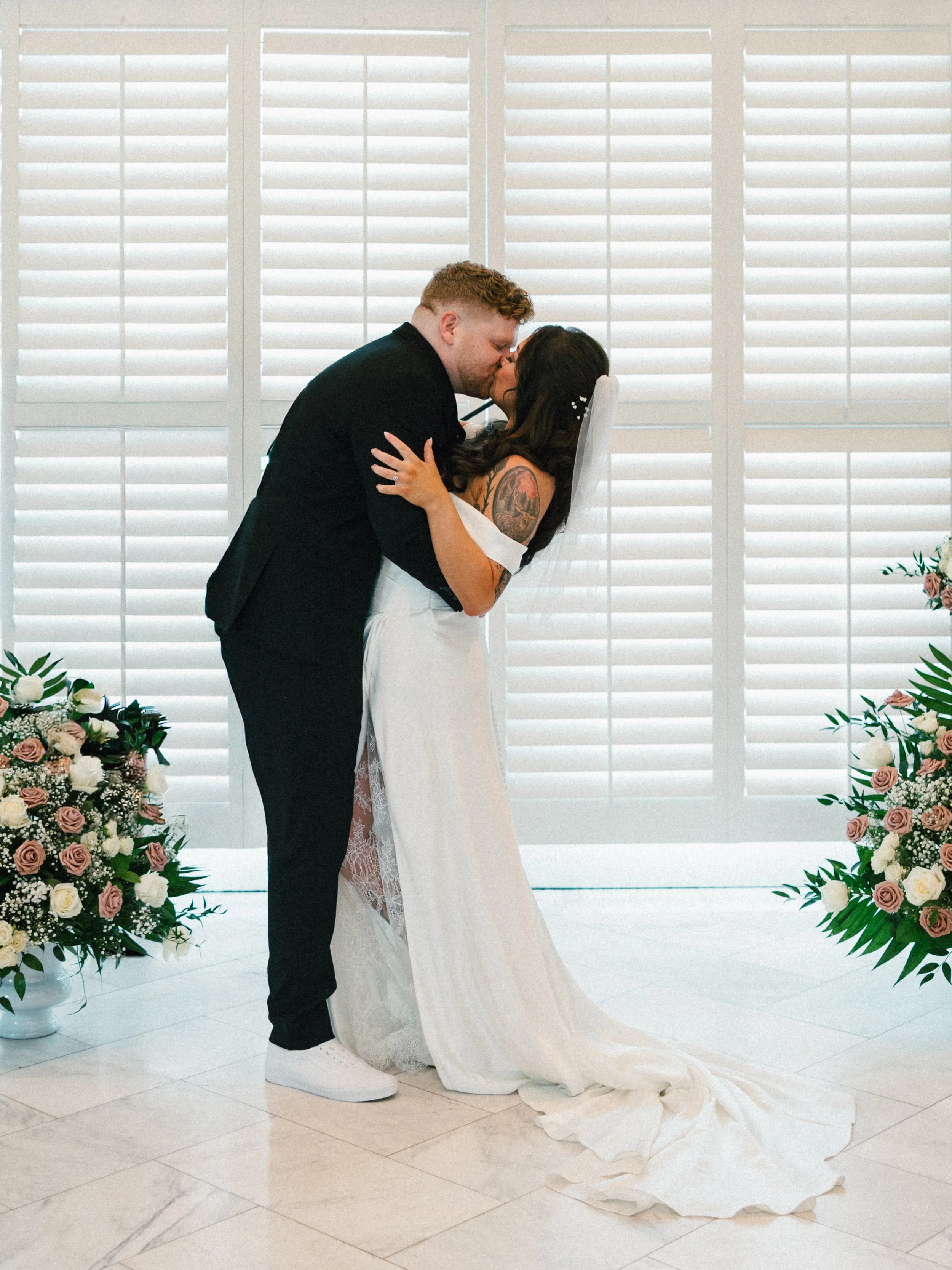 bride and groom first kiss