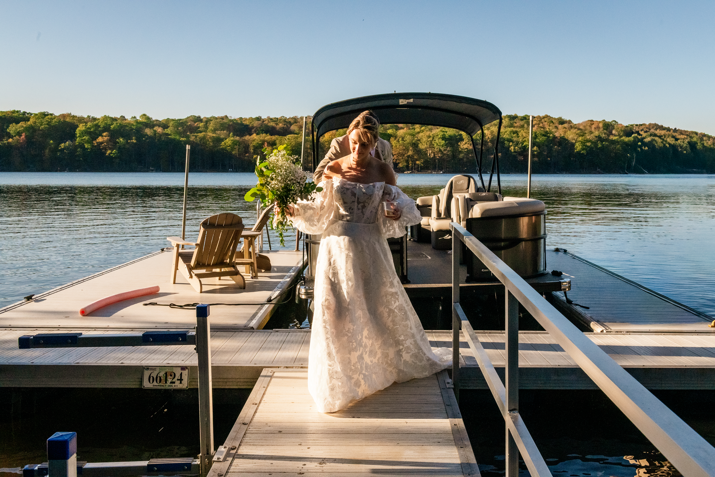 The bride exiting her boat, a very unforgettable way to make an entrance (or exit) at Deep Creek Lake.