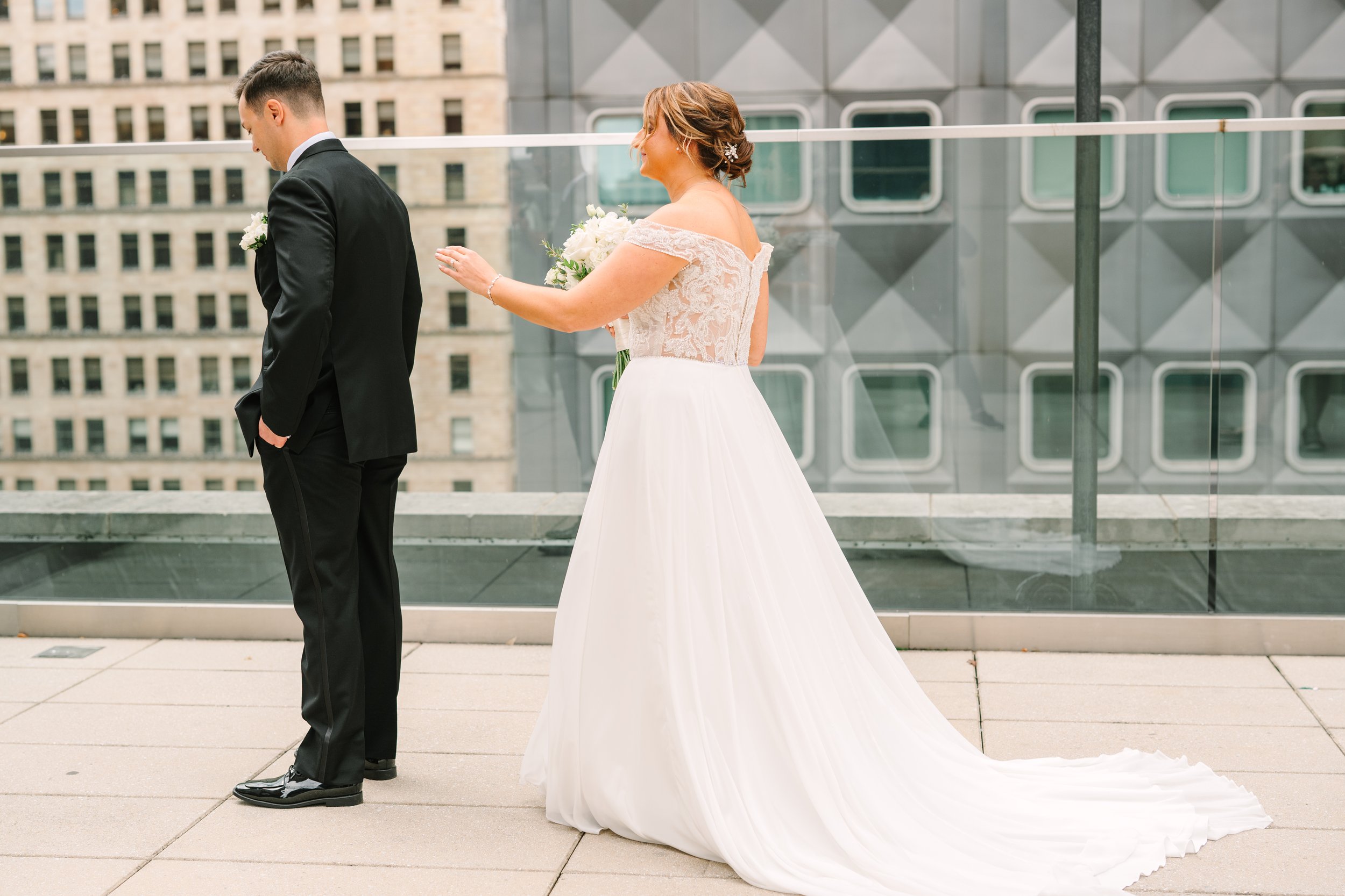 A couple about to do their first look on the rooftop of Hotel Monaco, in downtown Pittsburgh.