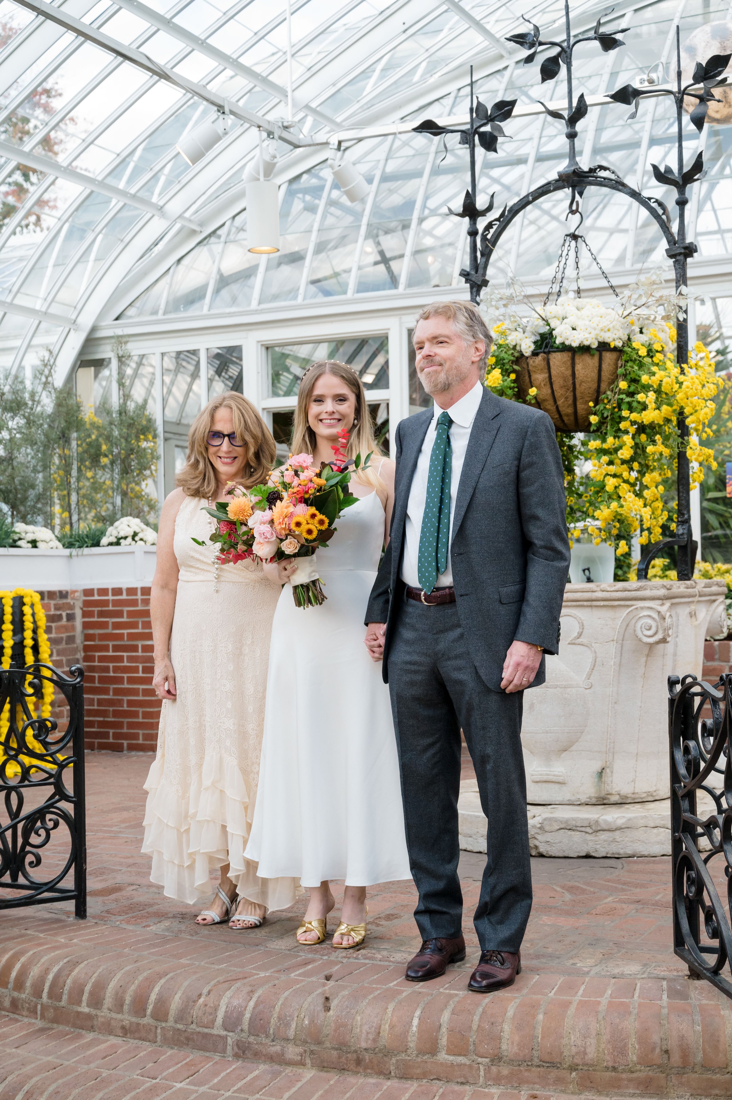 Image of Bride at Phipps Conservatory with her parents. Photos By Joe Appel Photography