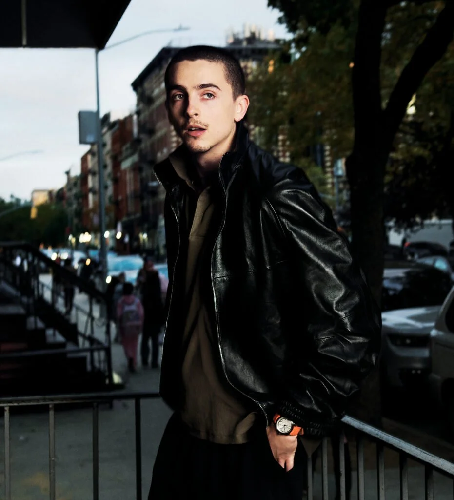 Timothee-Chalamet_UJwithOrangeStrap_DSC_0052-e1776834014792-931x1024.jpg