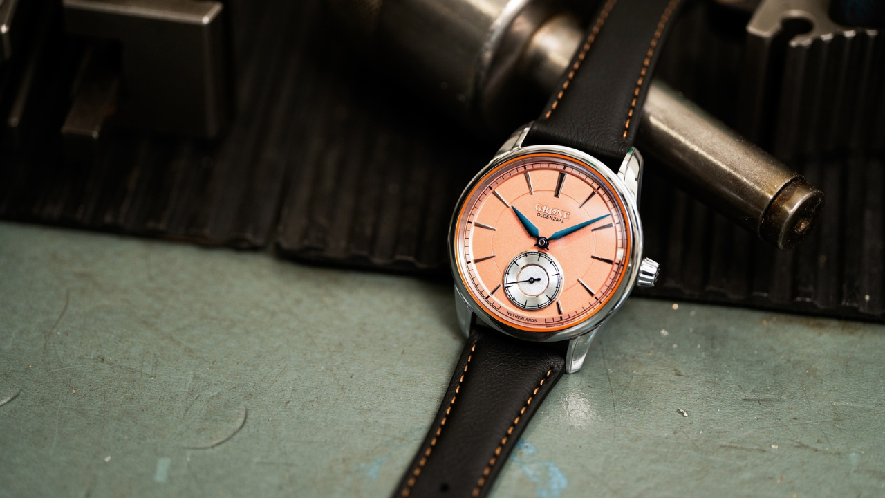 Grøne Horologium Small Seconds: laranja holandês com ponteiros azuis e salmão sunray com fundo gravado em neerlandês, 188 peças