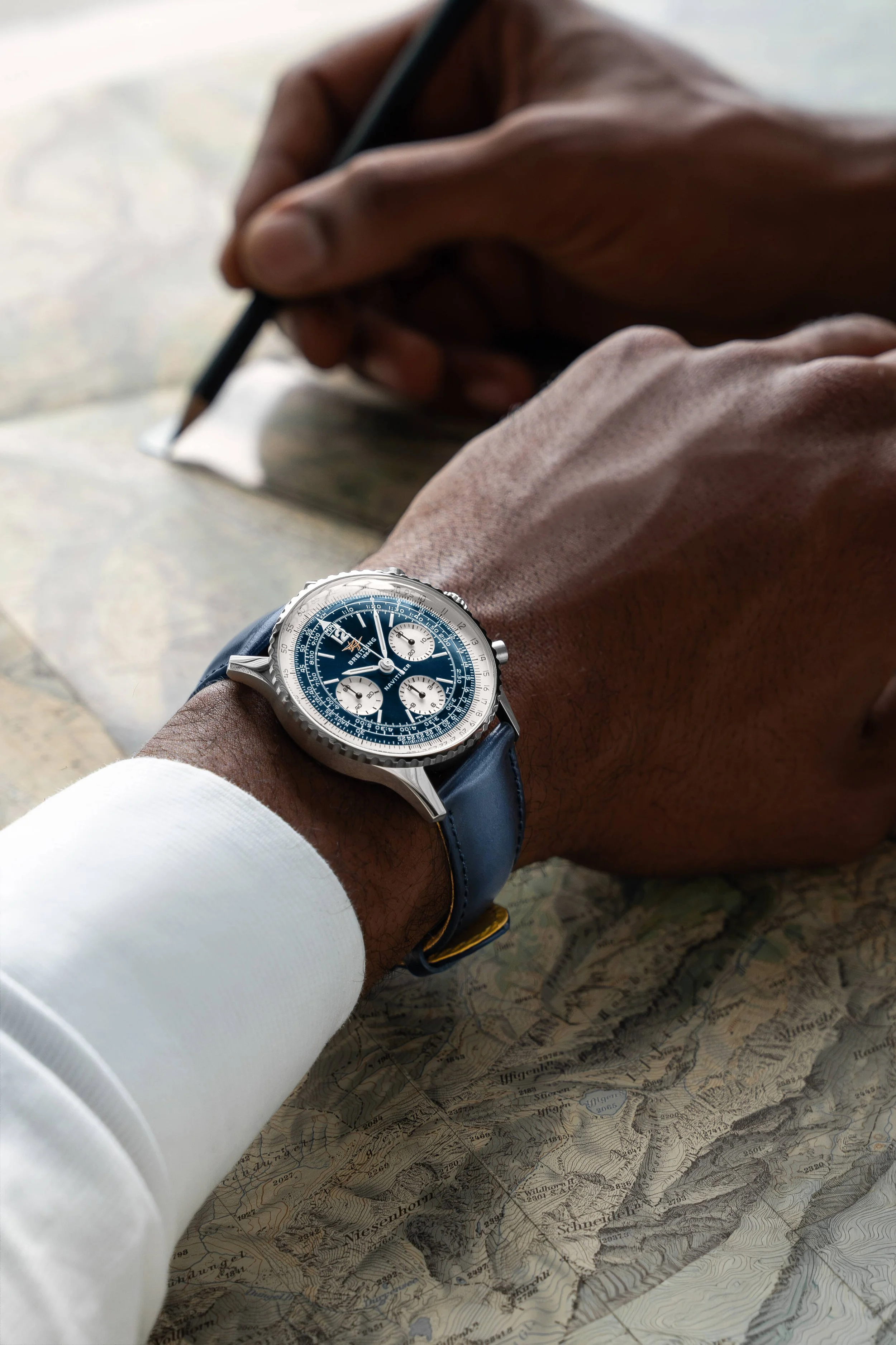 Breitling-Navitimer-B09-Chronograph-41_Blue-Dial_Leather_Wrist-Shot_RGB.jpg