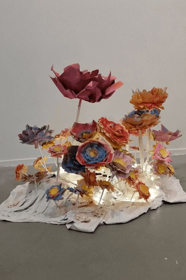 No Dumping, 2016 - Paper, textiles, wood, acrylic paint, utensils, string lights, barrel