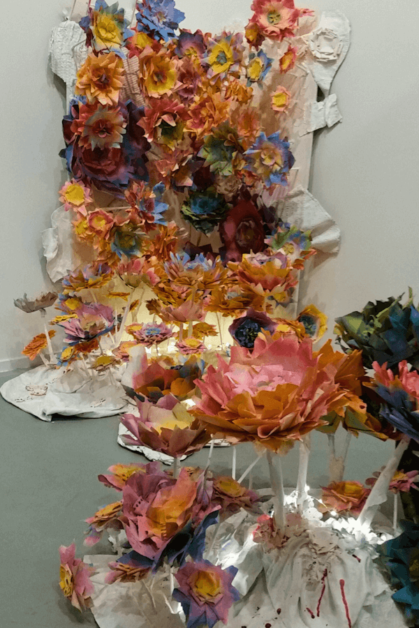 No Dumping, 2016 - Paper, textiles, wood, acrylic paint, utensils, string lights, barrel