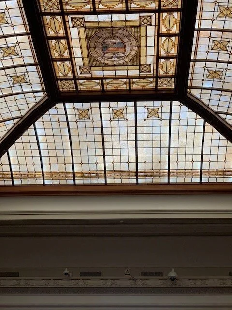 Povey glass in courtroom.