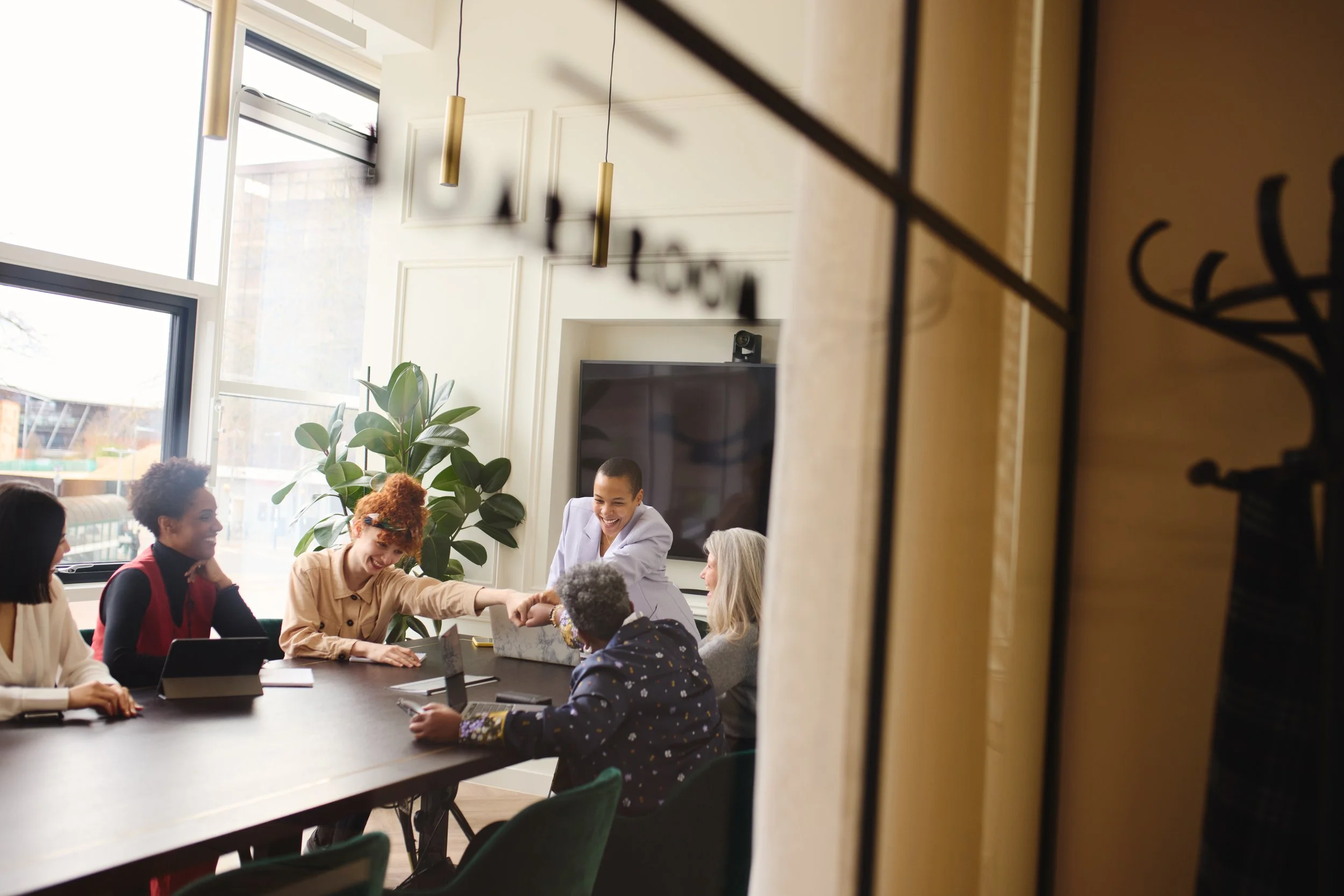 view-through-window-of-multiethnic-businesswomen-f-2026-01-06-09-22-55-utc.jpeg