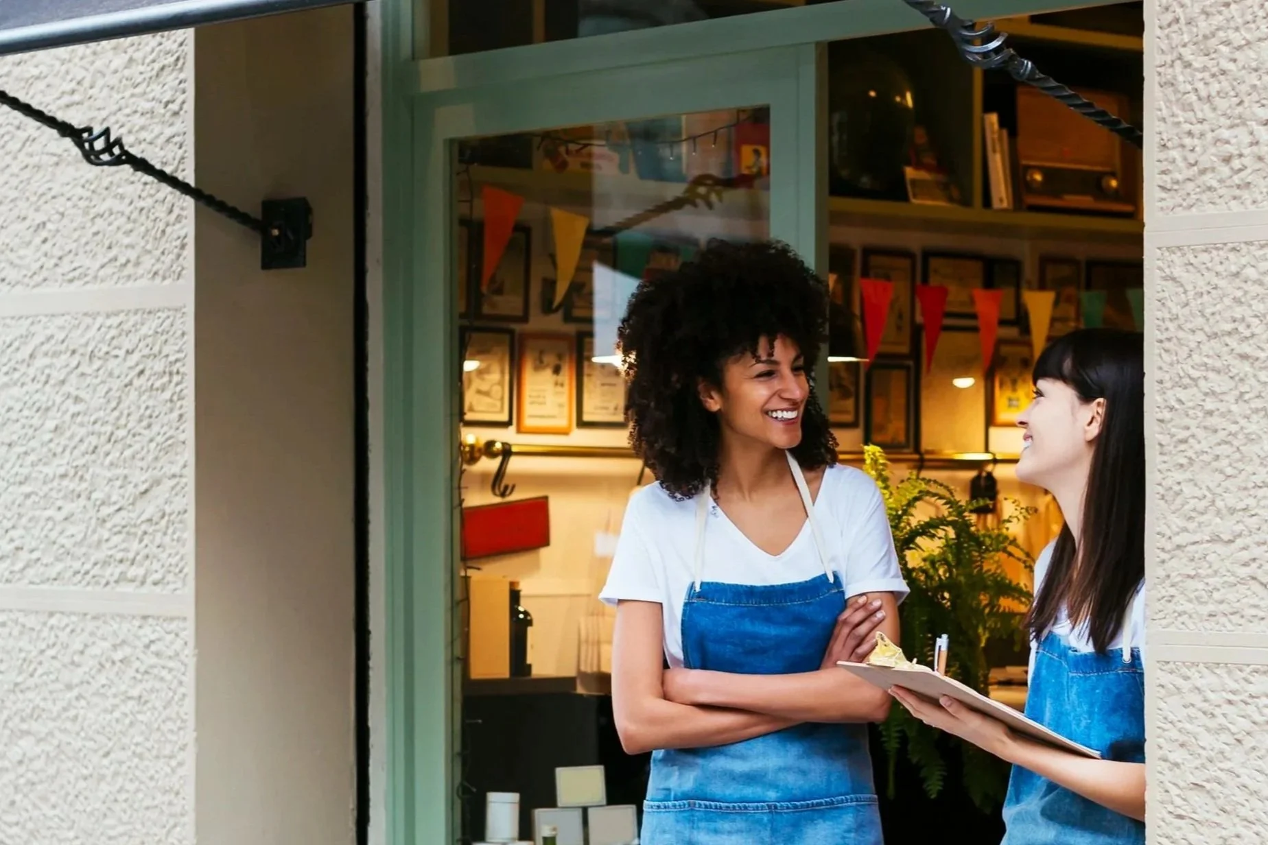 Man working on an iMac computer in an office environment.