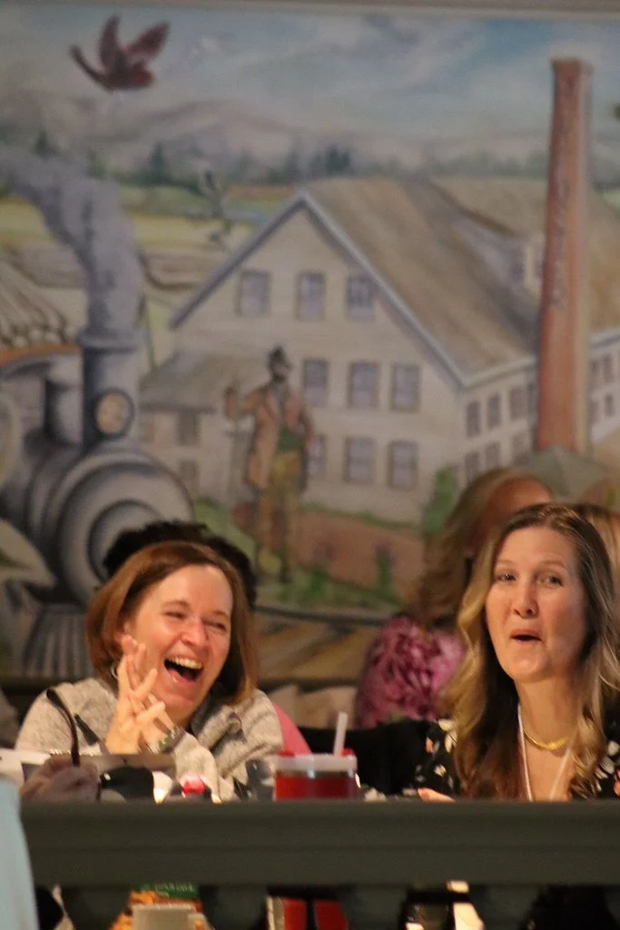 Women speaking at a WELL Women Educators Leading Learning educational conference