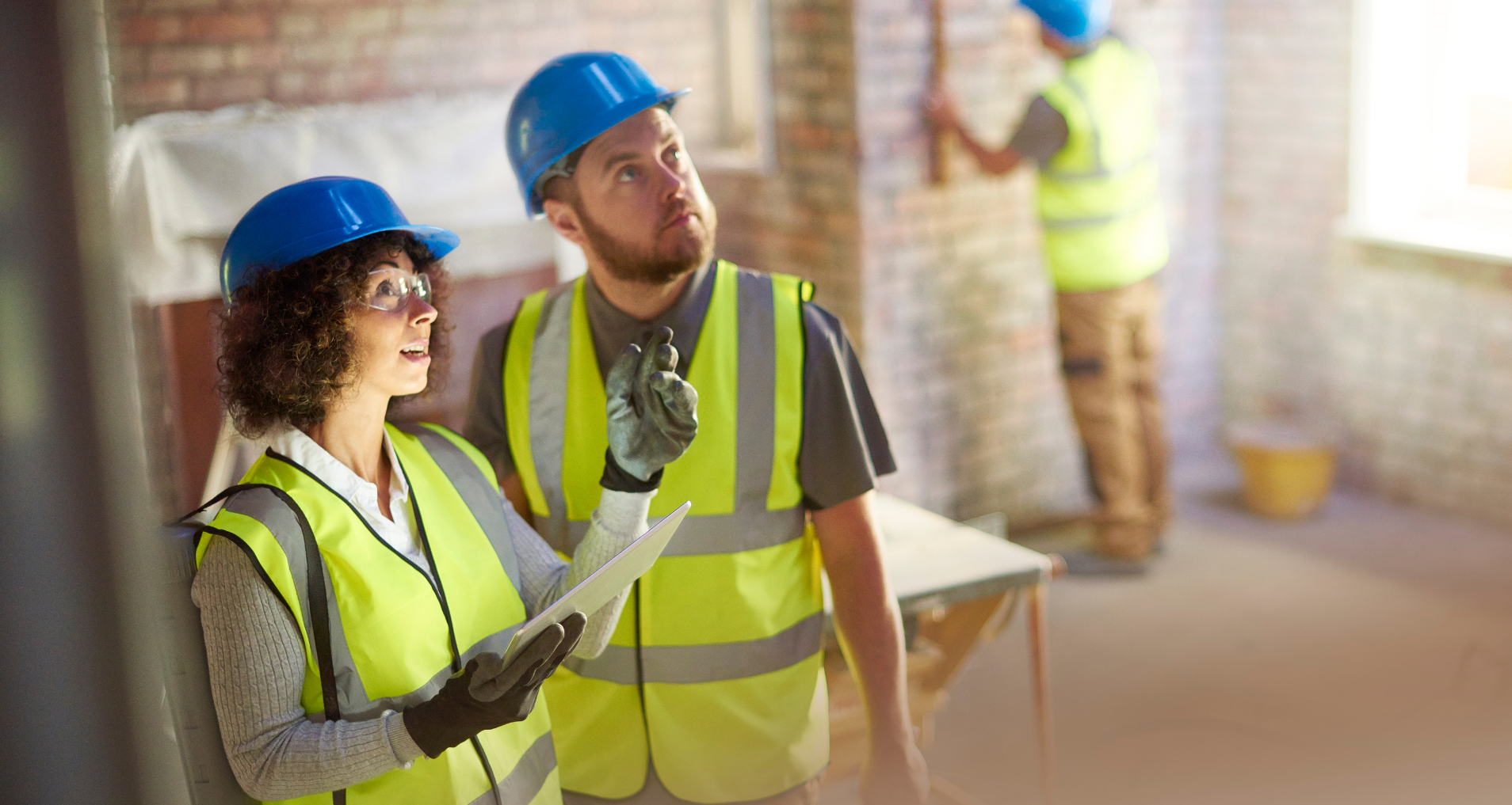 builders assessing the building