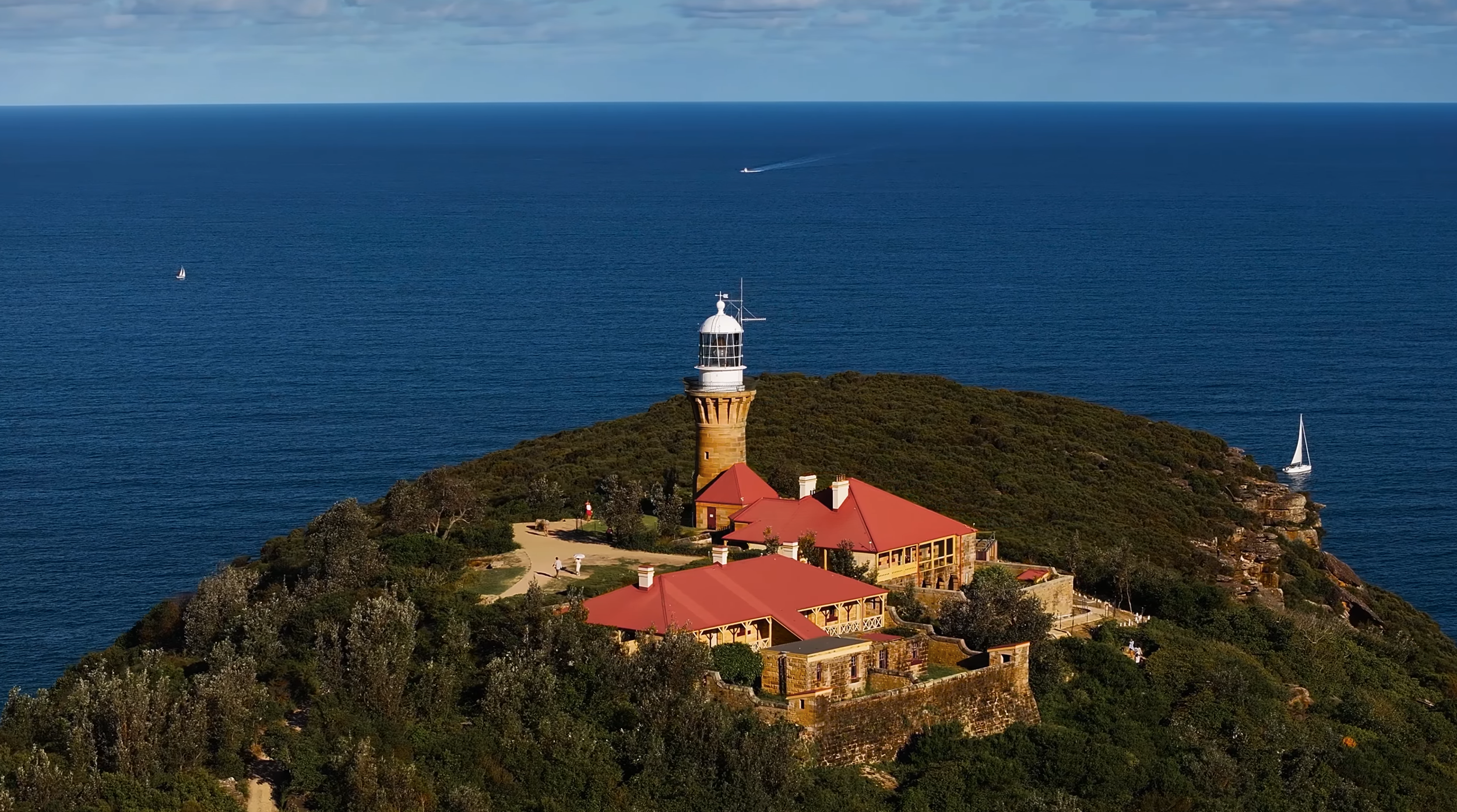 Drone aerial view of lighthouse on Sydney coastline captured by licensed drone operator